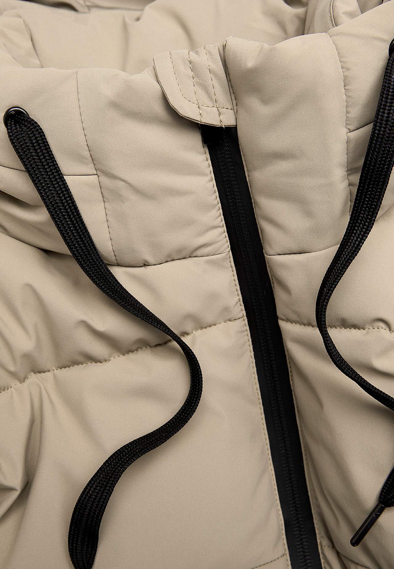 Warm coat with side zips at the bottom