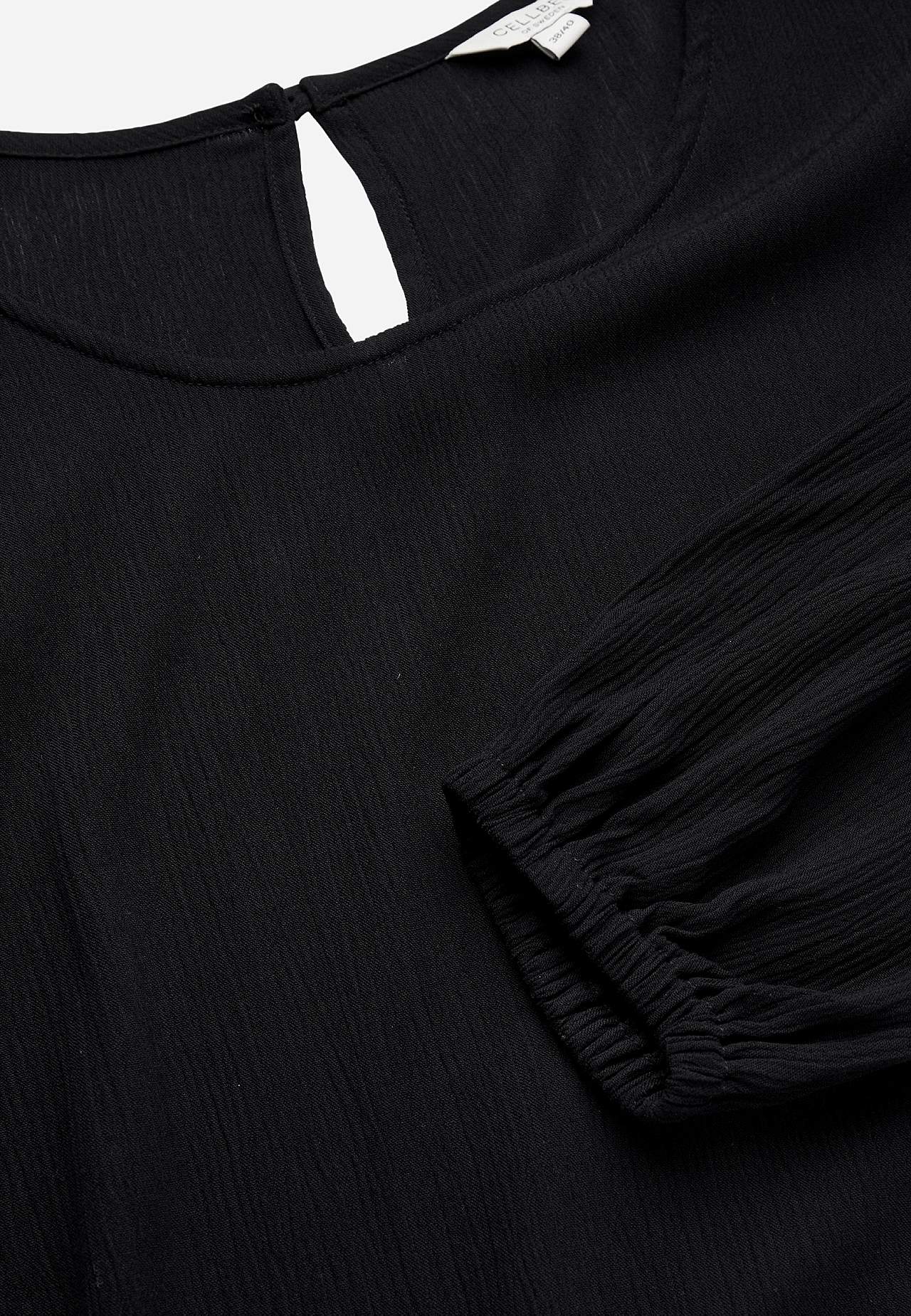 Tunic with textured weave fabric