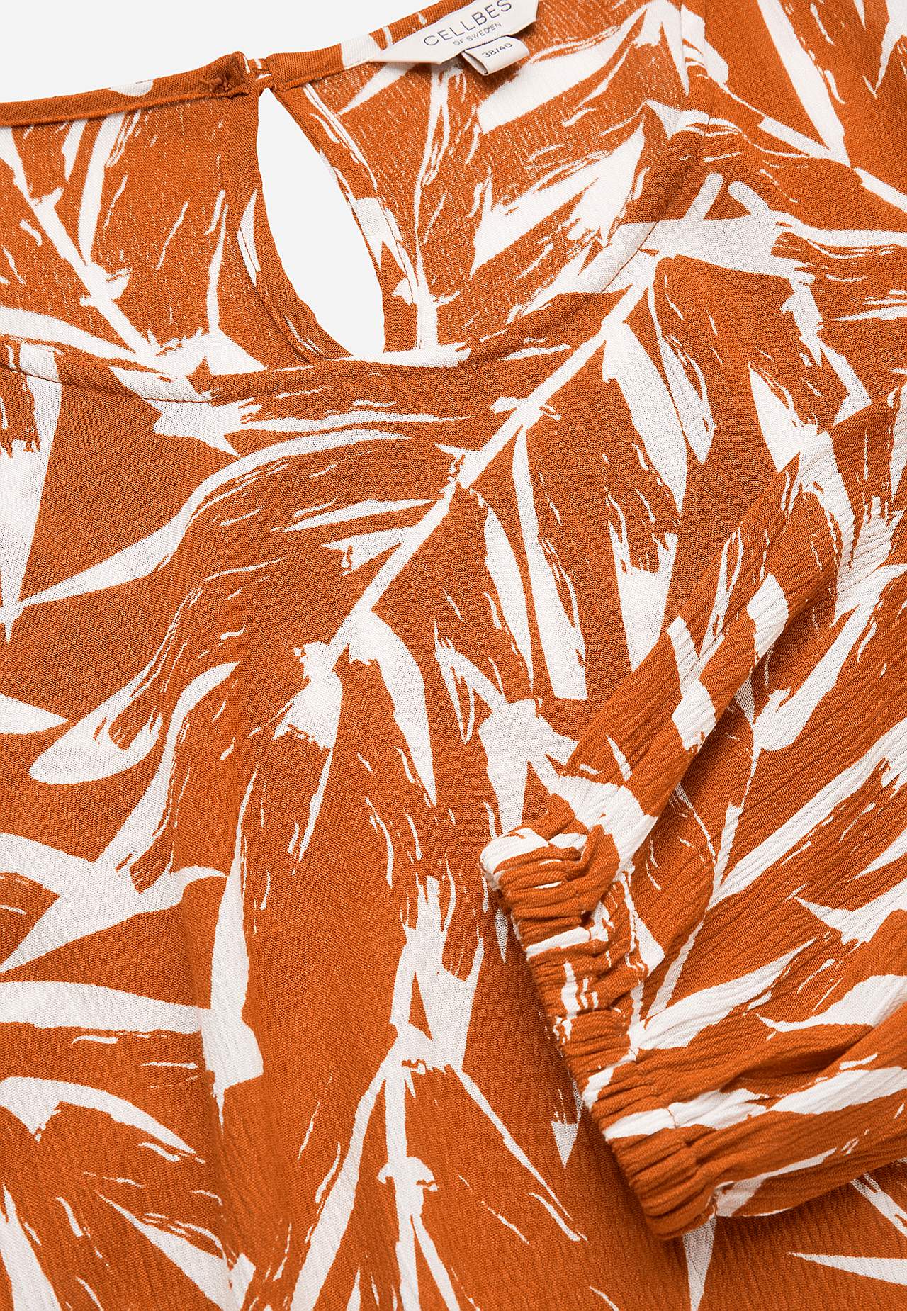 Tunic with textured weave fabric