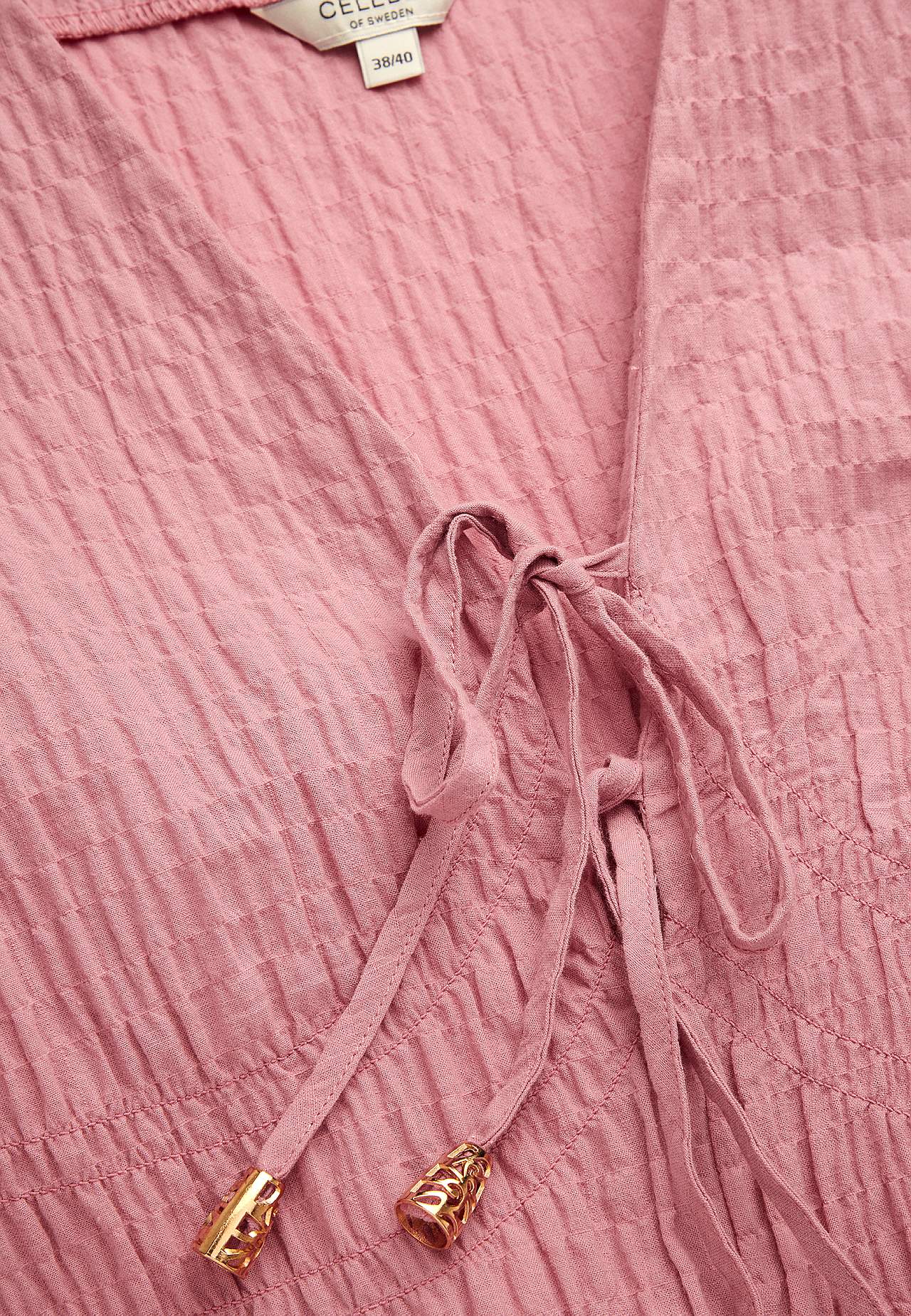 Long-sleeved dress with knot details Trieste