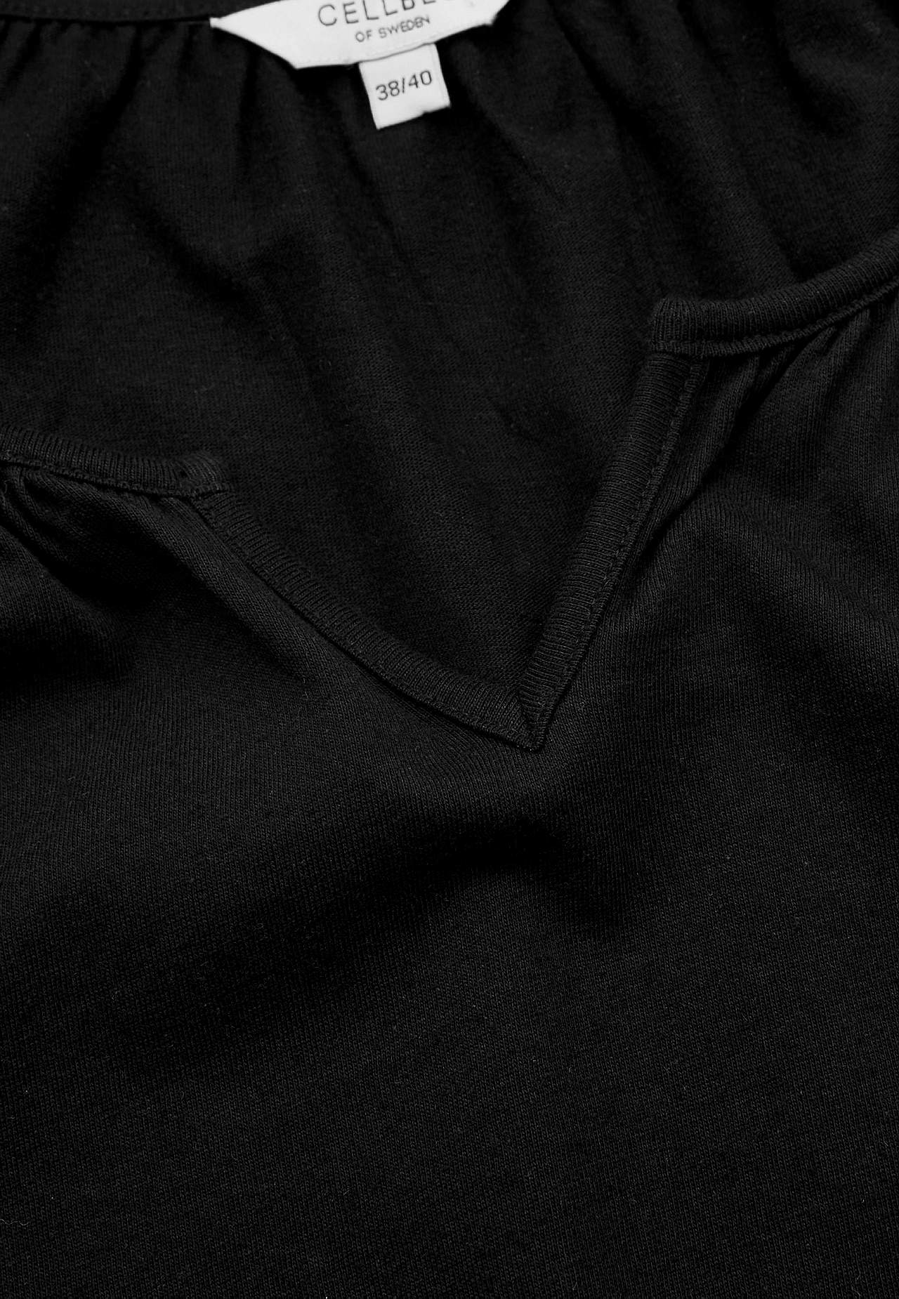 Tunic with frill at the bottom