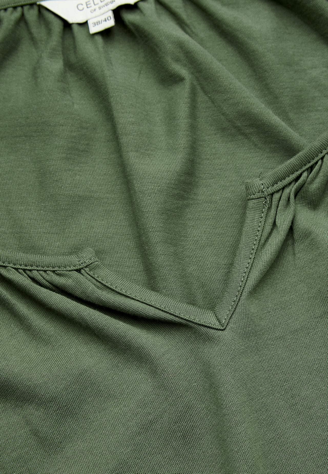 Tunic with frill at the bottom