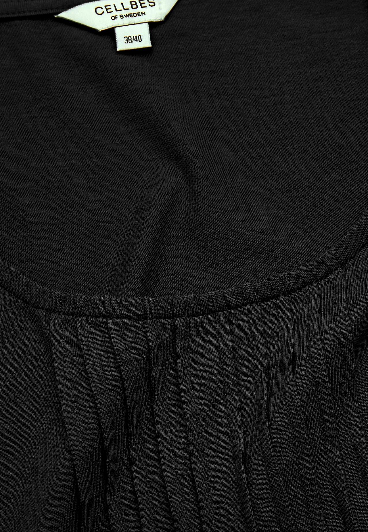 Top with decorative pin-tuck