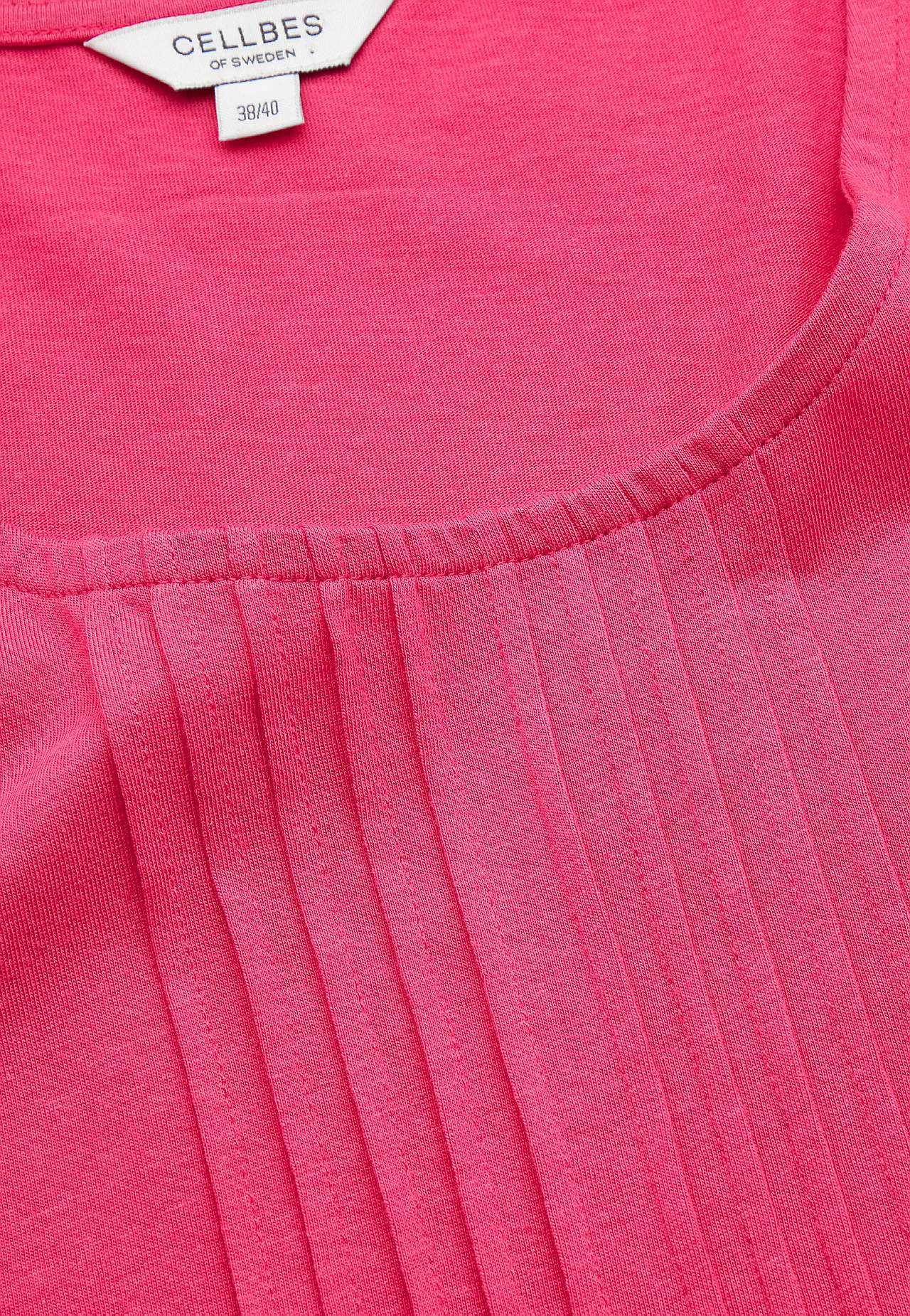 Top with decorative pin-tuck