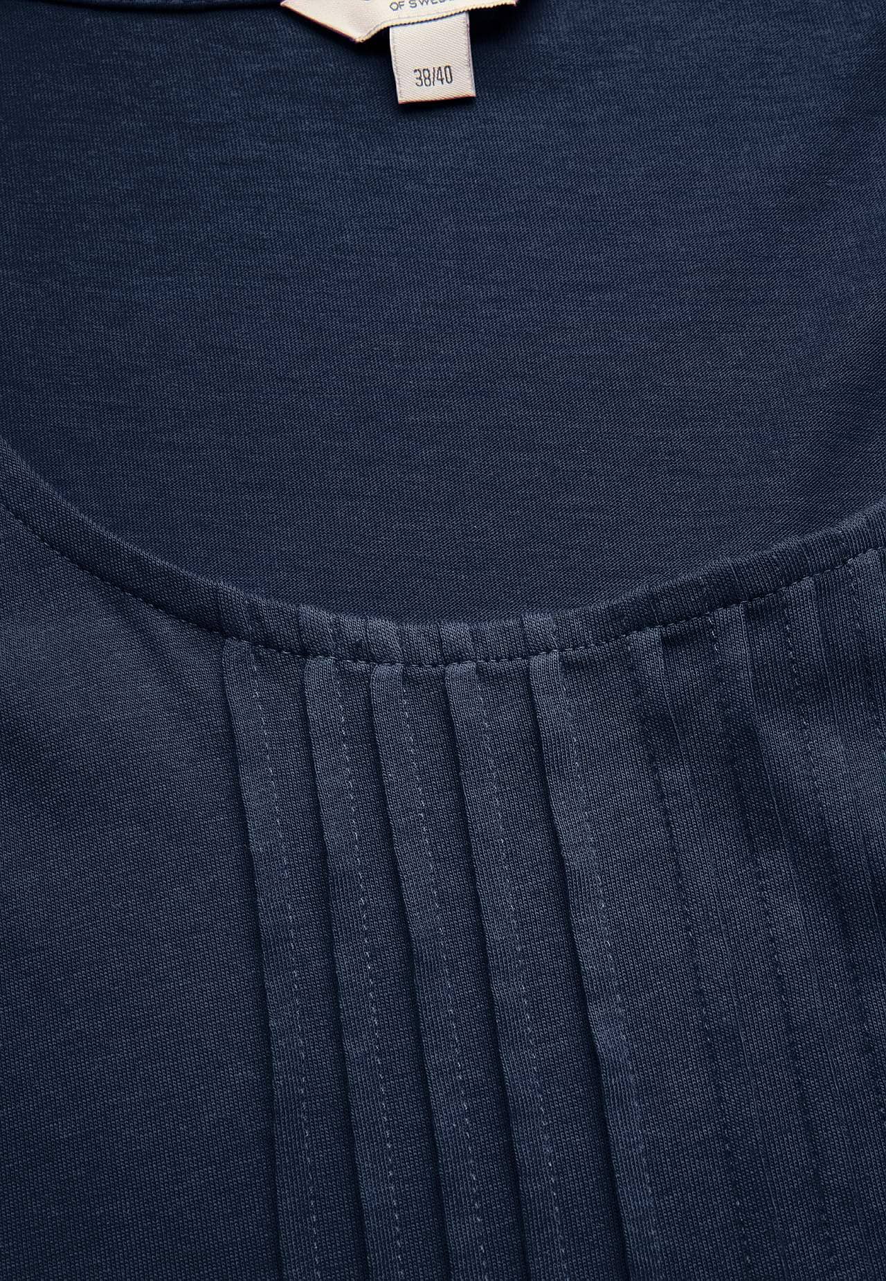 Top with decorative pin-tuck