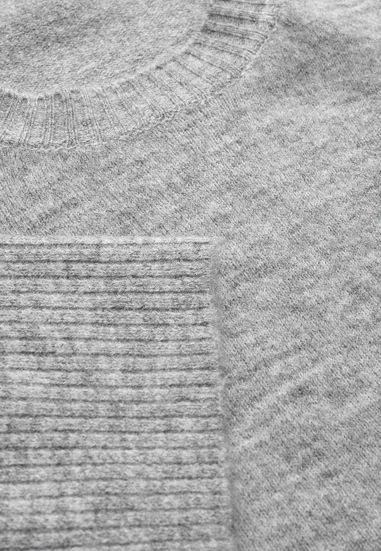 Knitted sweater with slits