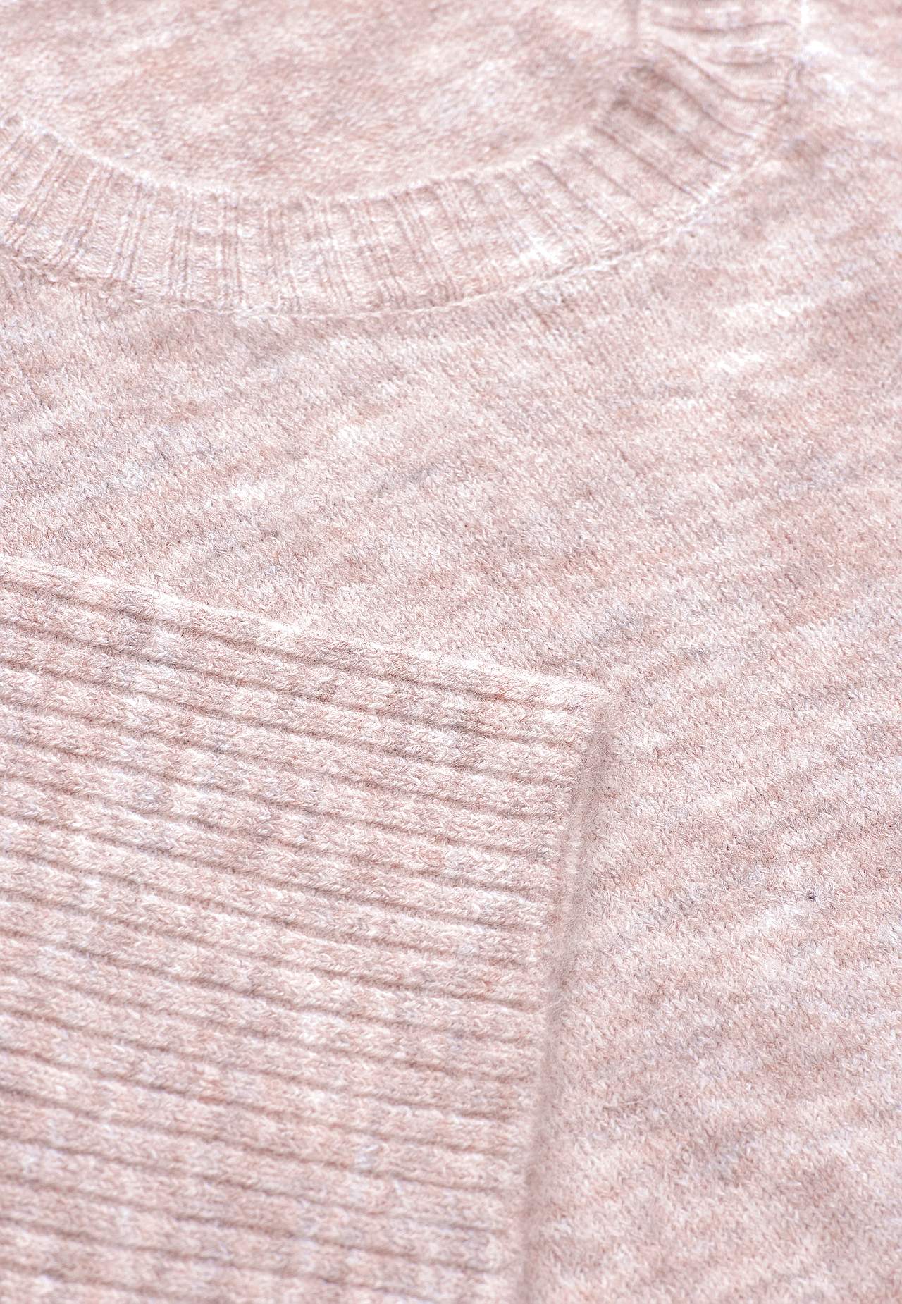 Knitted sweater with slits