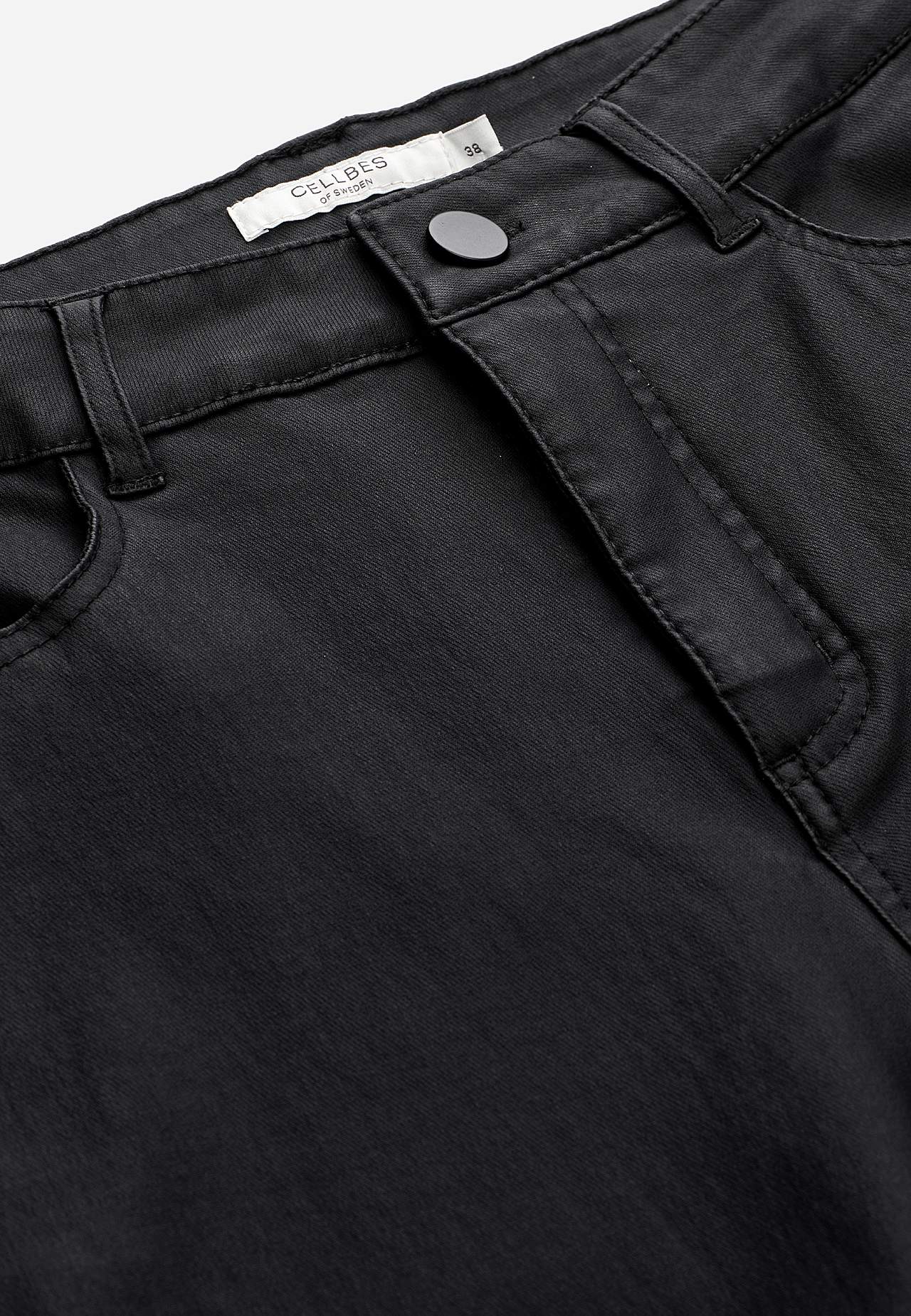 Coated trousers with straight legs