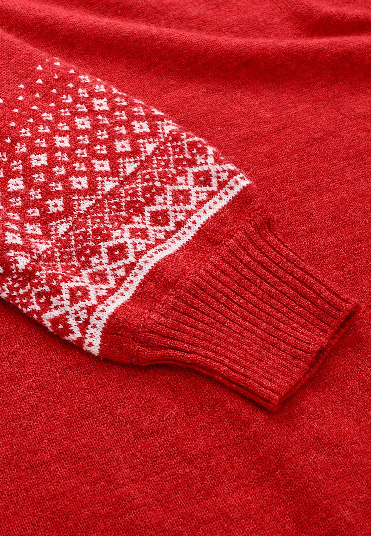 Knitted dress with jacquard patterned sleeves