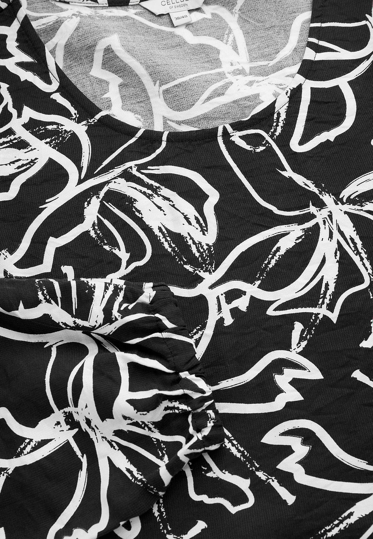 Woven, patterned tunic top