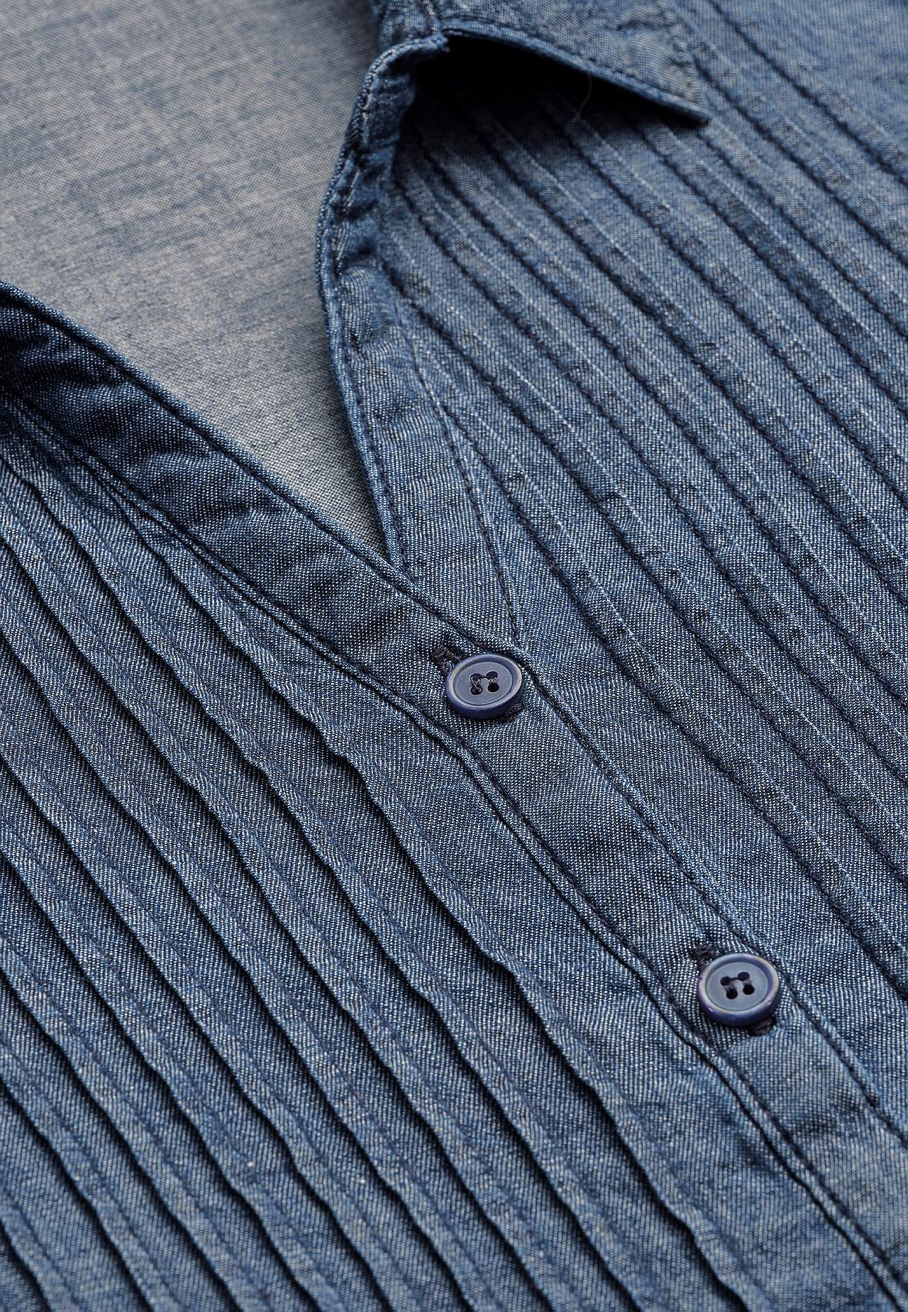 Denim blouse with sewn pleats