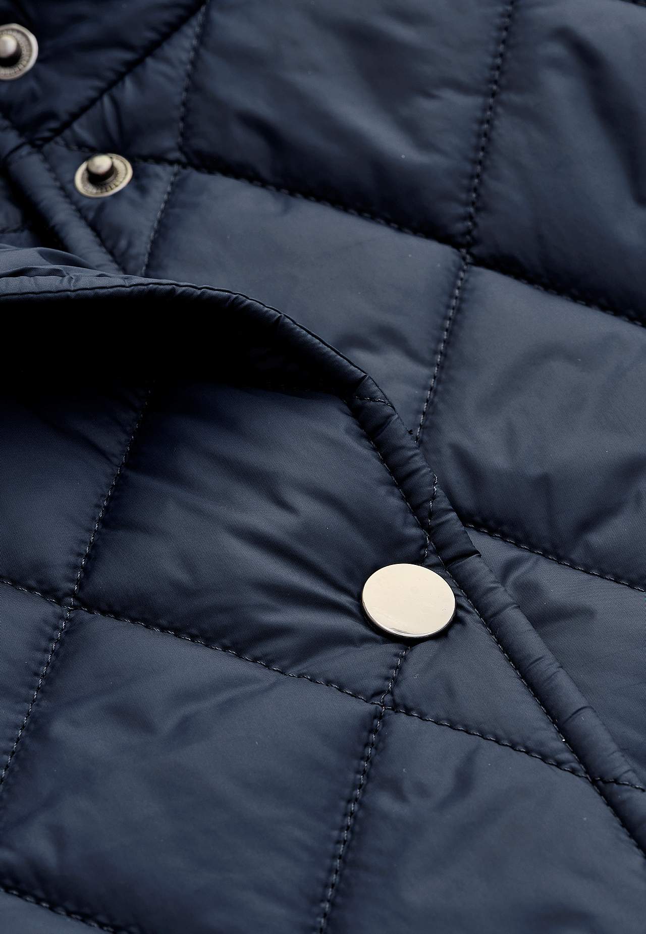 Quilted jacket with snap buttons