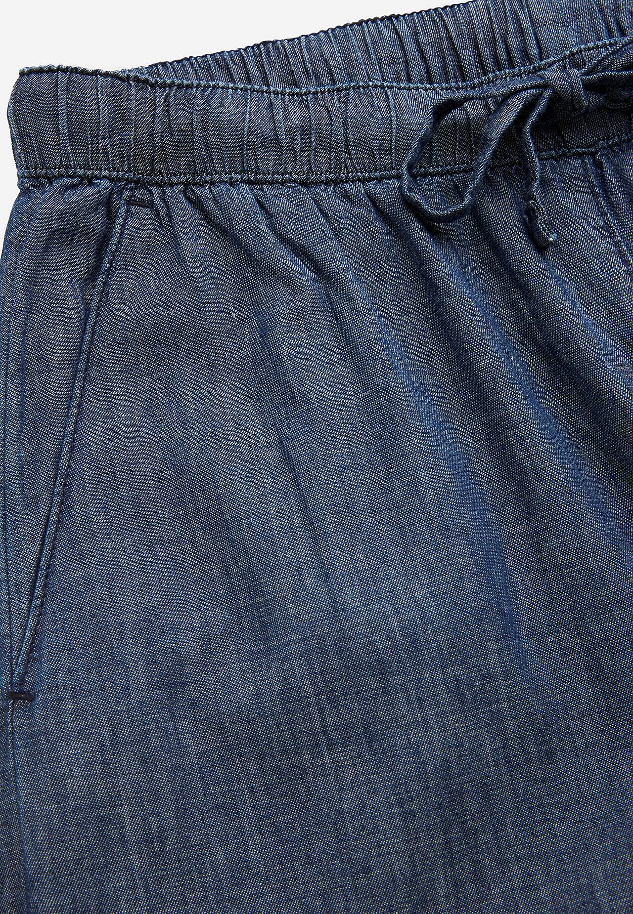 Trousers in denim with wide legs