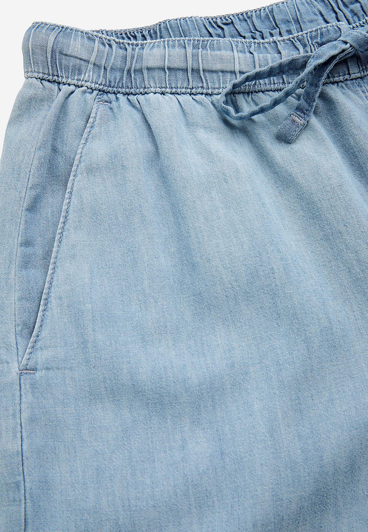 Trousers in denim with wide legs