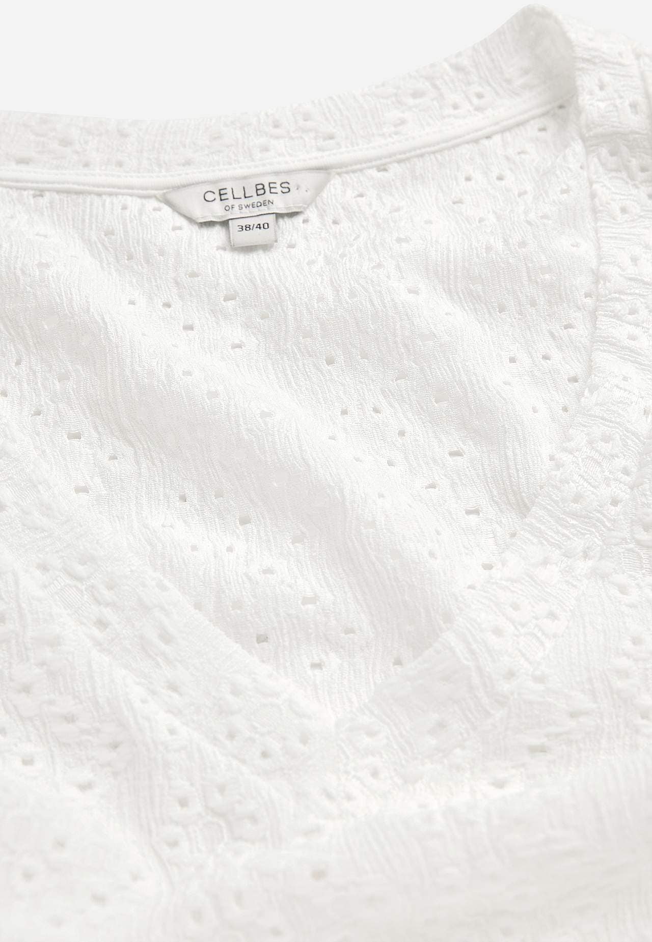 Jersey top with hole embroidery