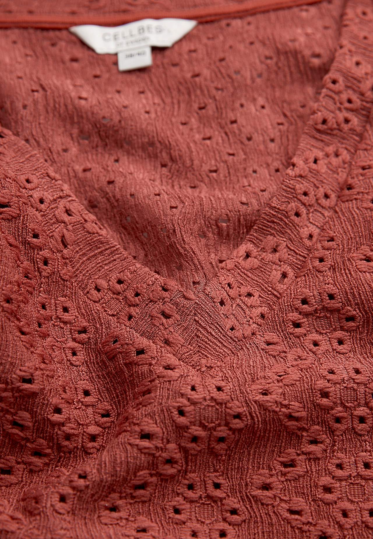 Jersey top with hole embroidery