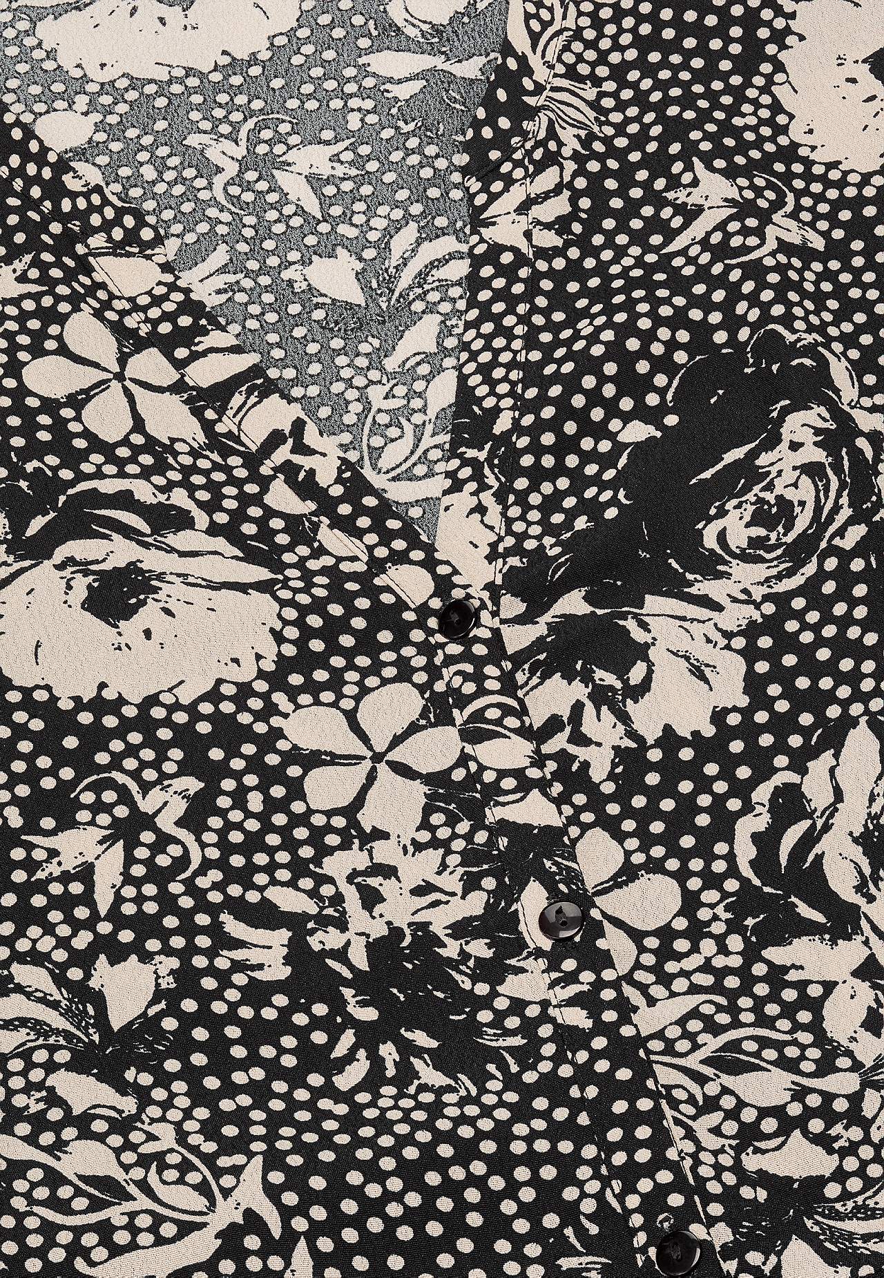 Dress in viscose with a flower pattern