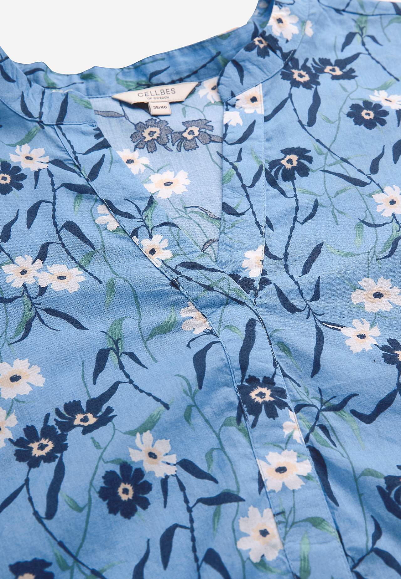 Woven tunic with a flower pattern