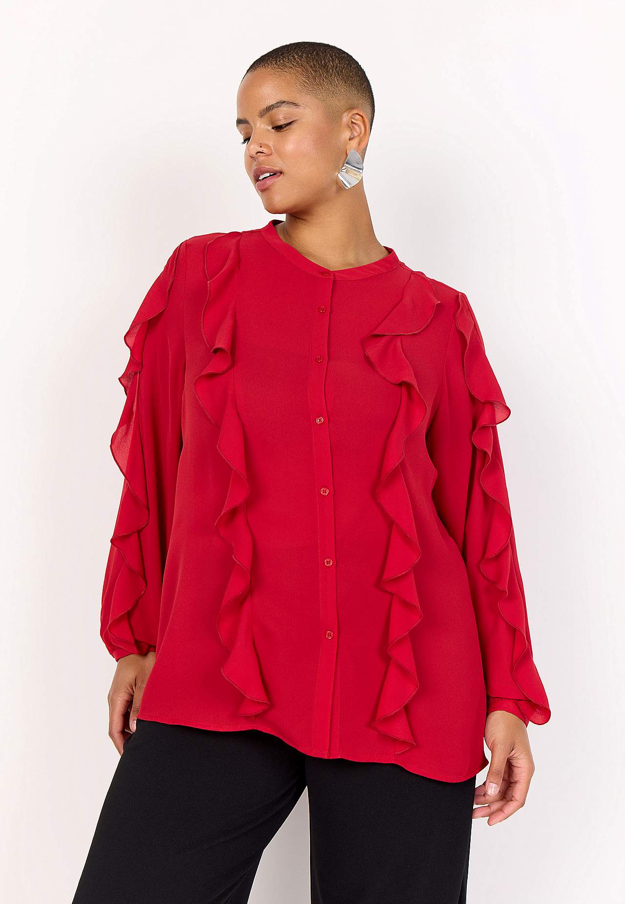 Blus med volanger