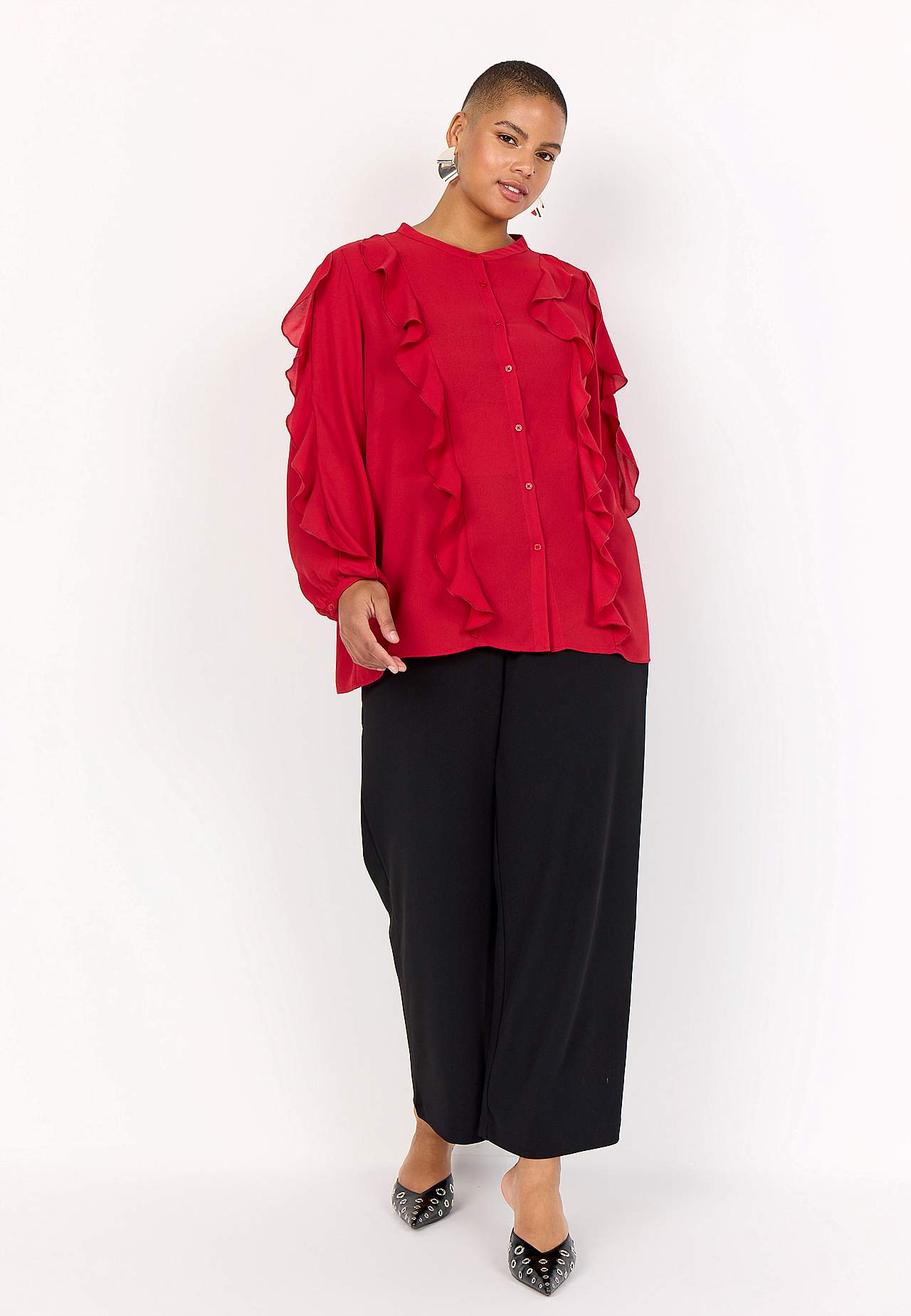 Blus med volanger