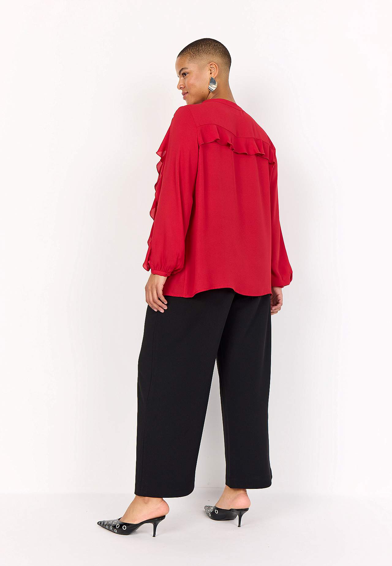 Blus med volanger