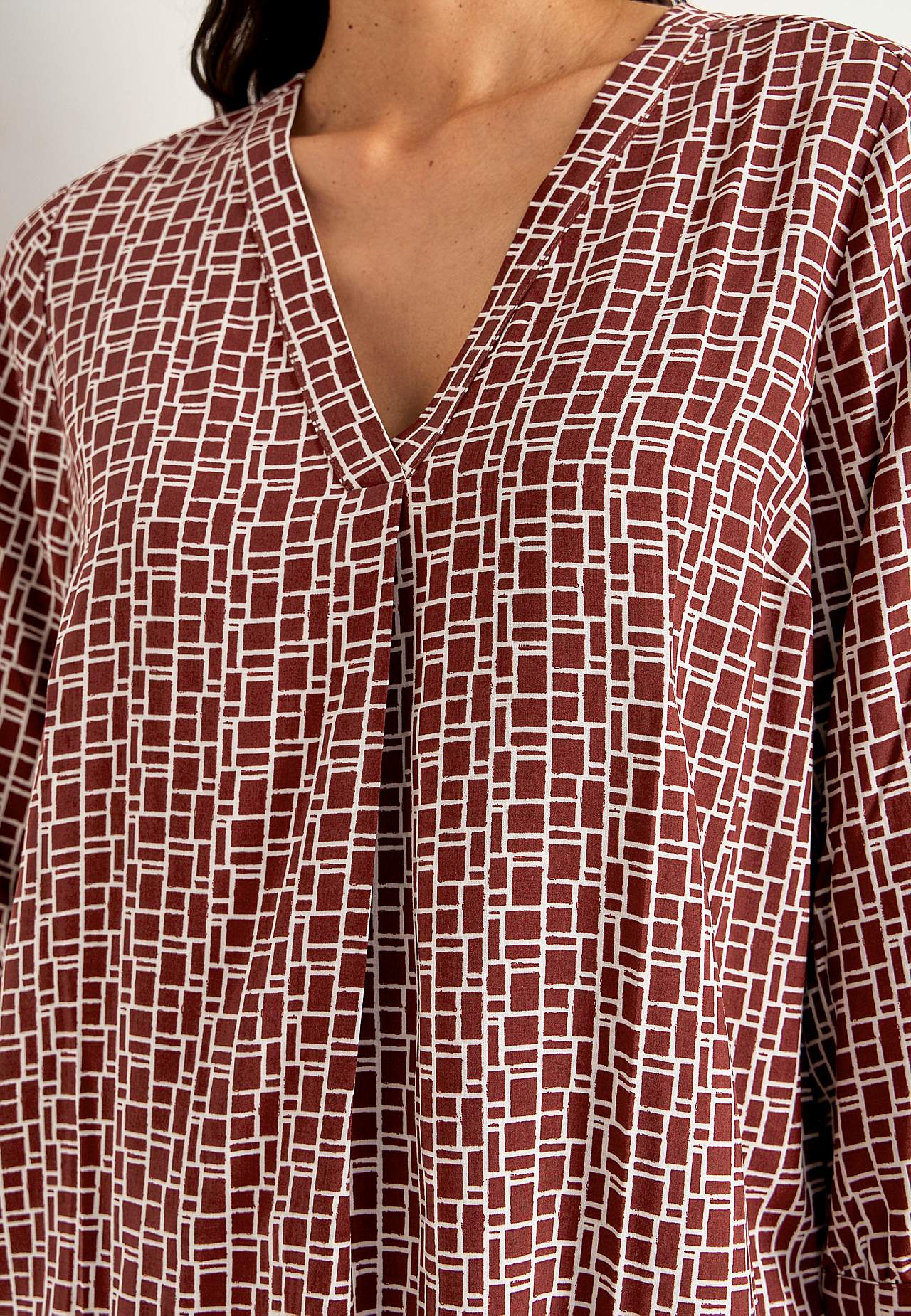V-neck, woven blouse