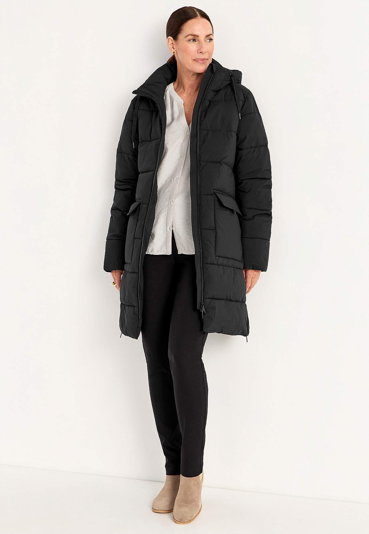 Warm coat with side zips at the bottom