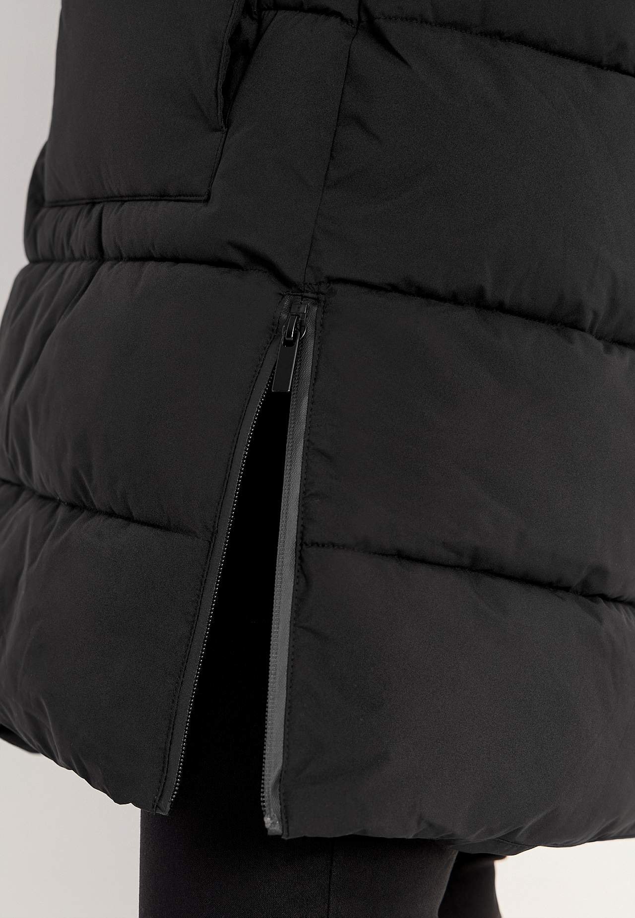 Warm coat with side zips at the bottom