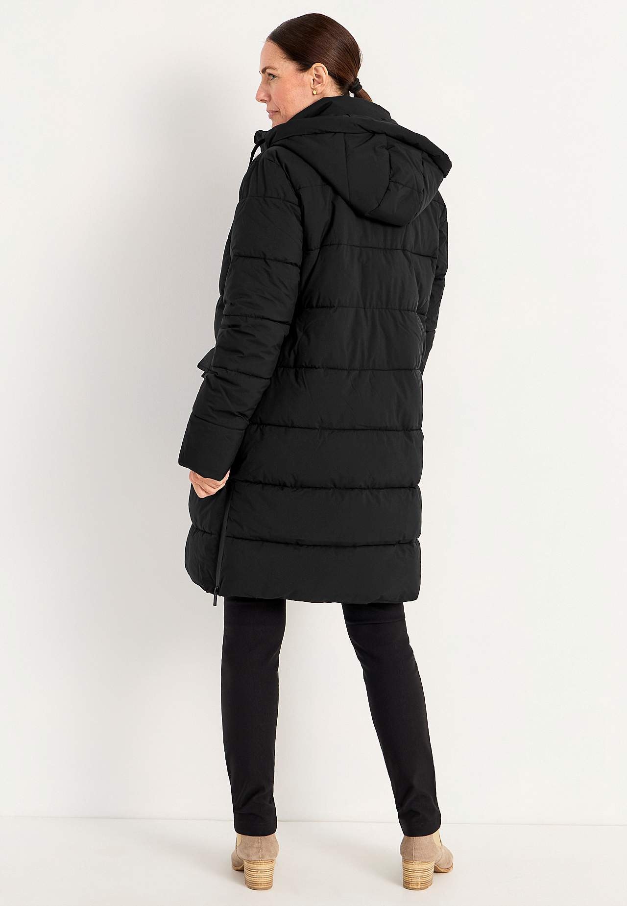 Warm coat with side zips at the bottom