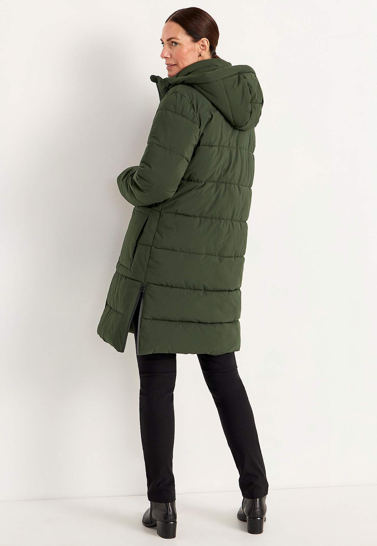 Warm coat with side zips at the bottom