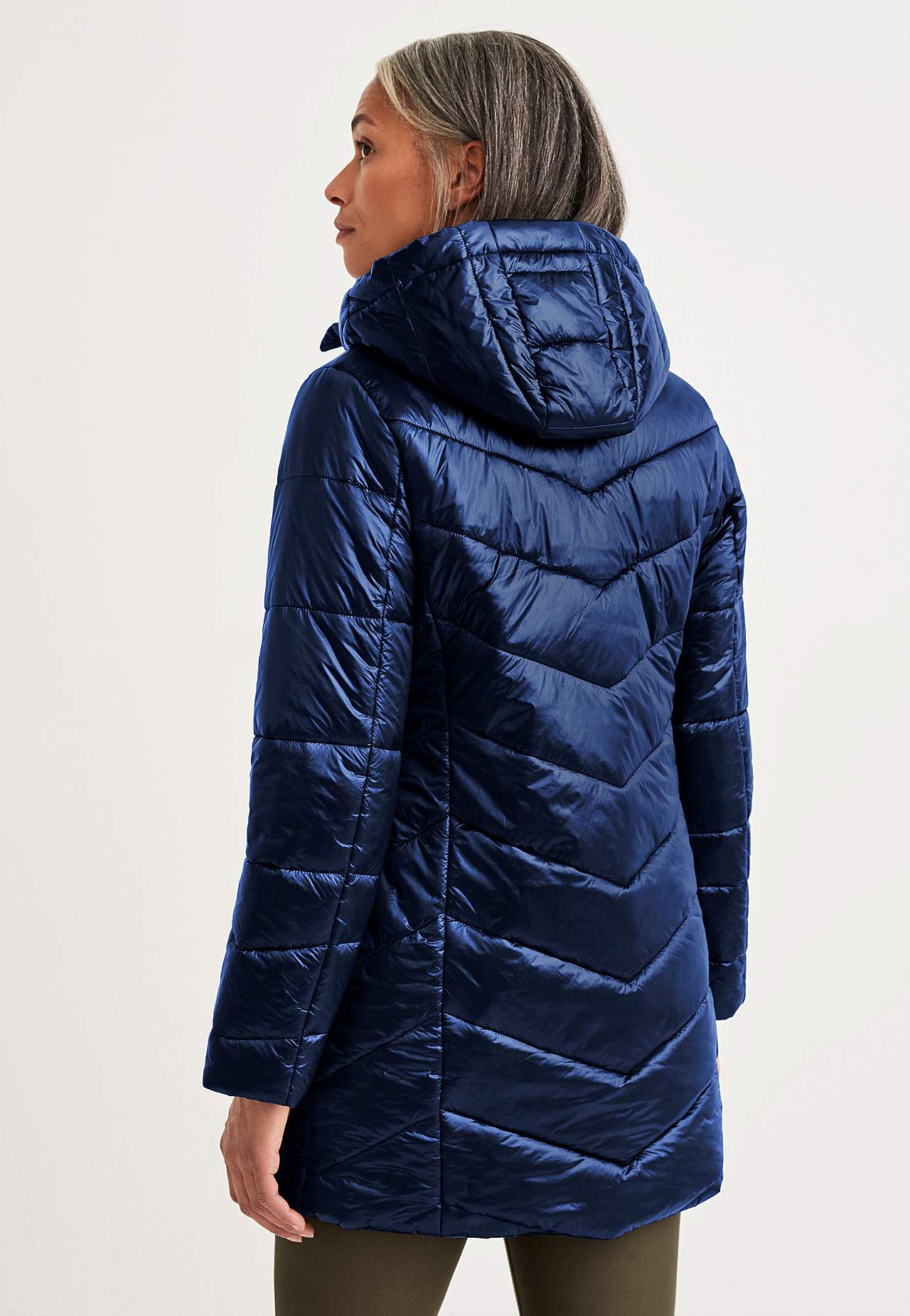 Padded jacket with shimmering fabric