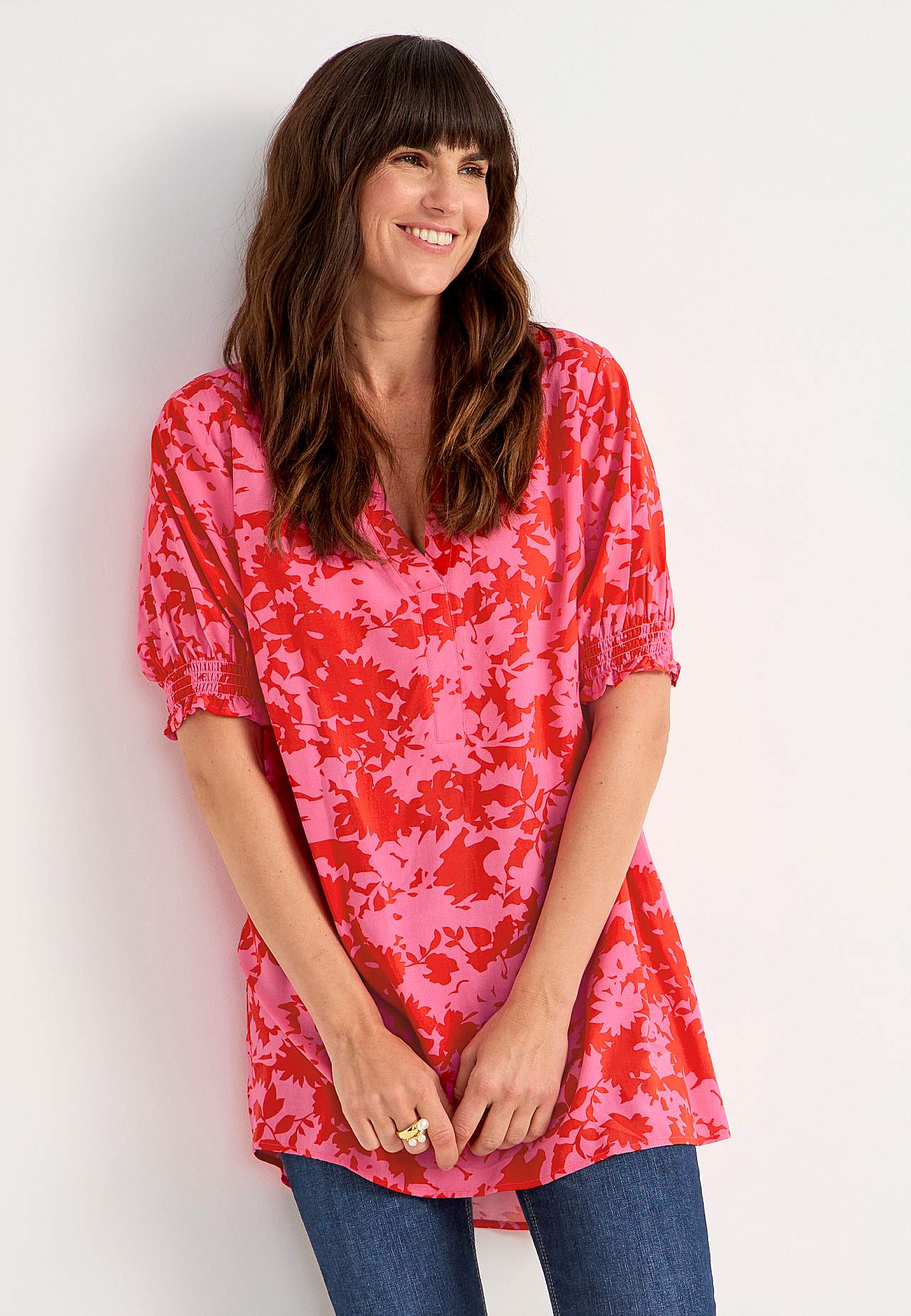 Tunic with smocking on the sleeve ends