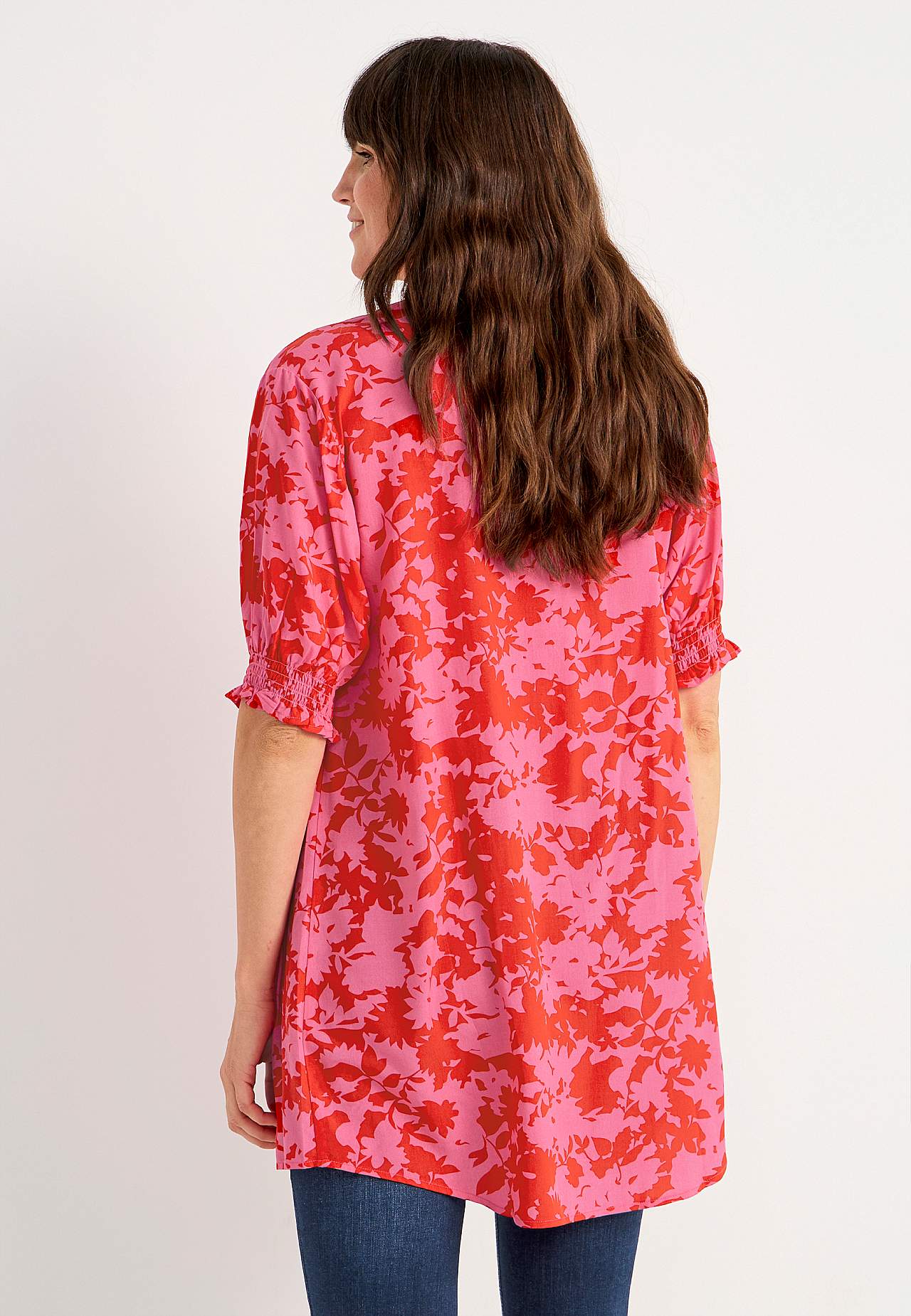 Tunic with smocking on the sleeve ends