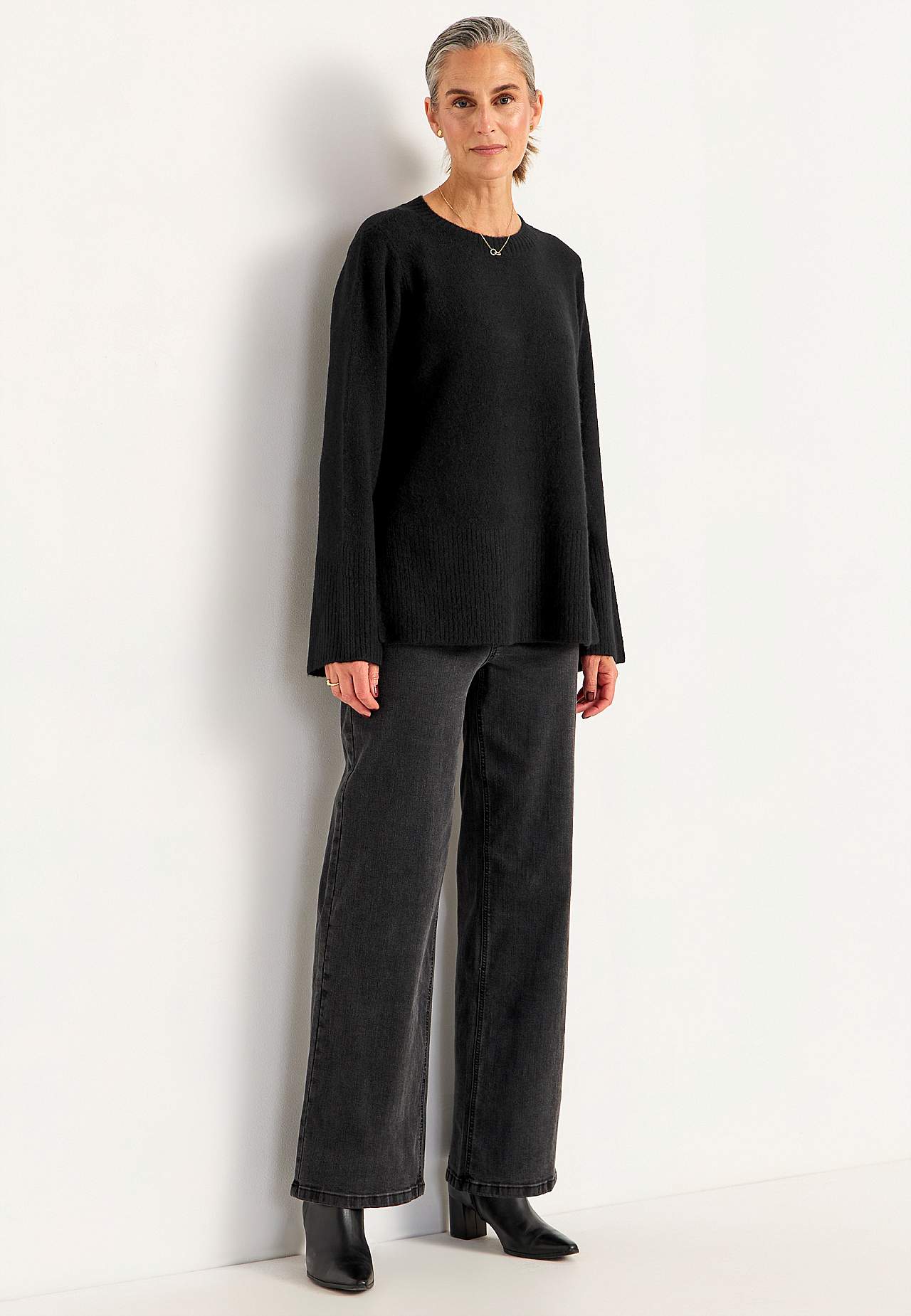 Knitted sweater with slits