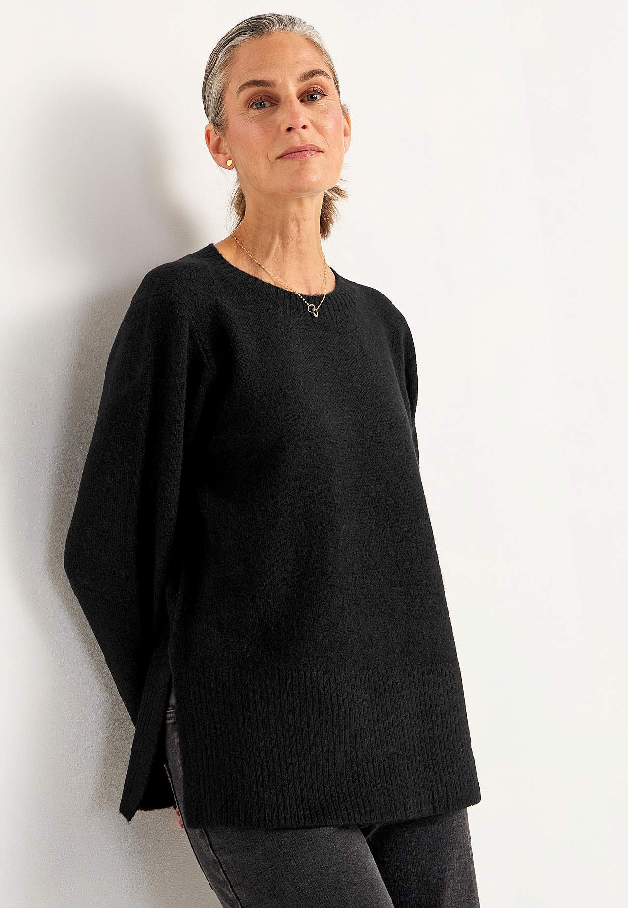 Knitted sweater with slits