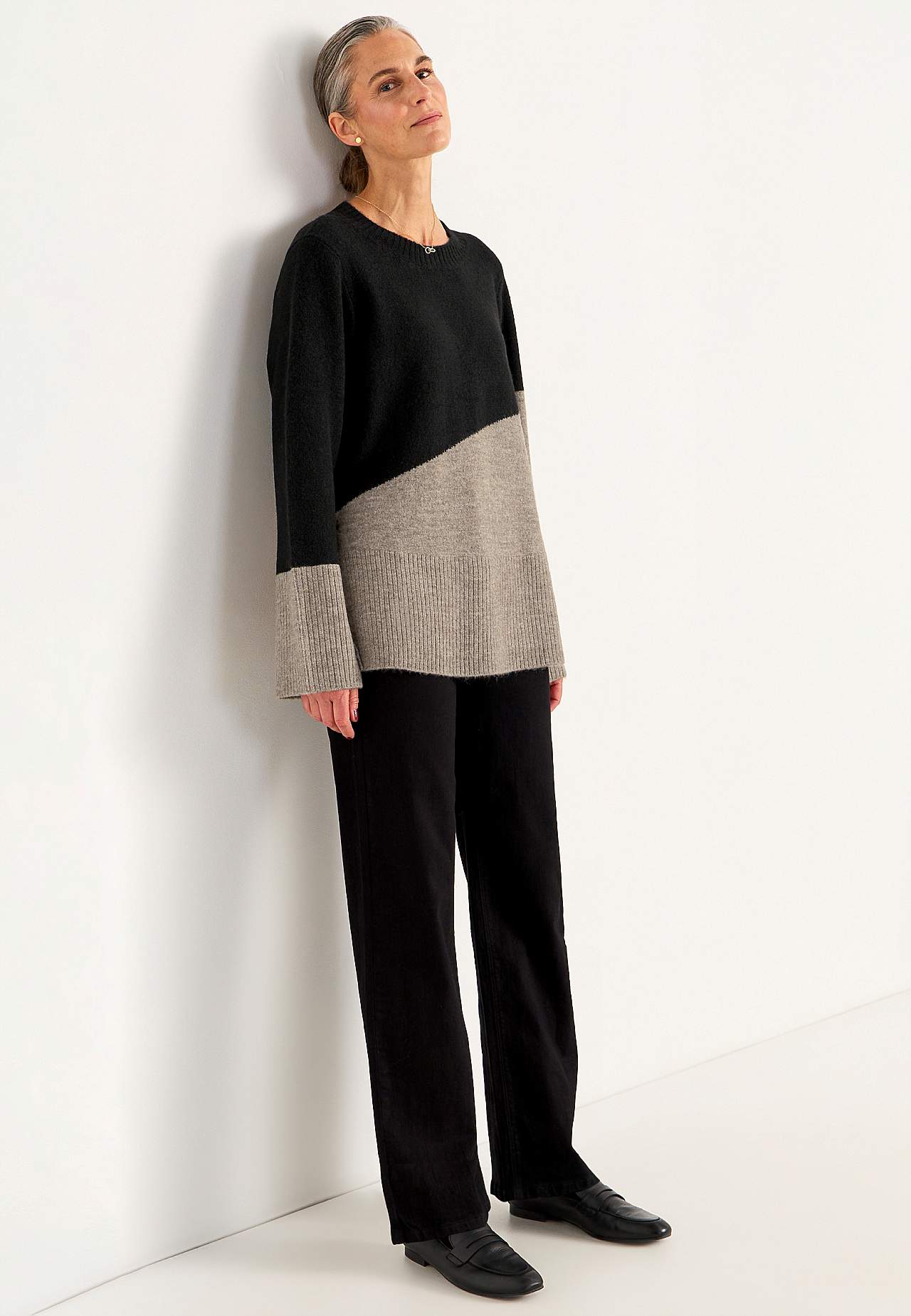 Knitted sweater with slits