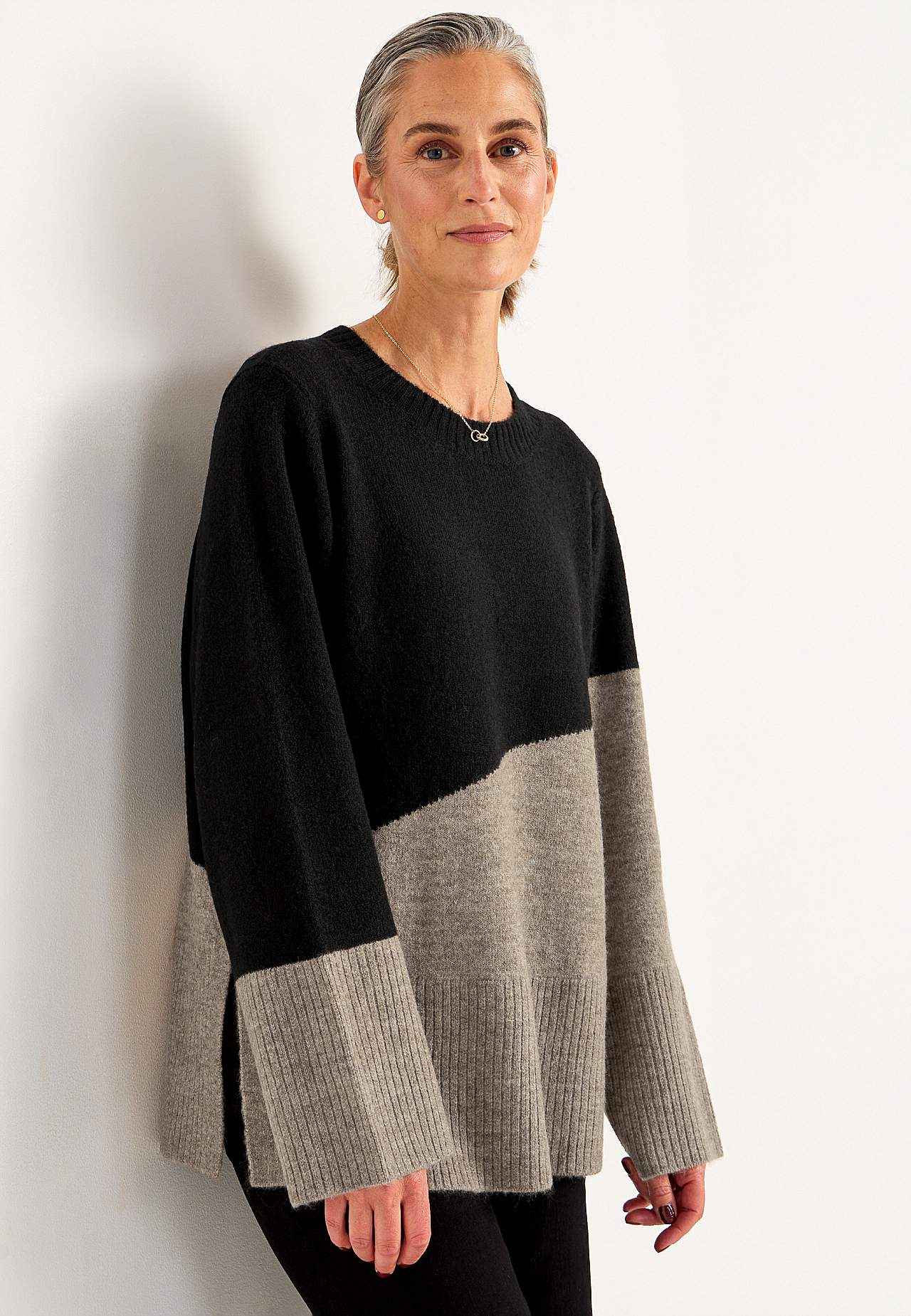 Knitted sweater with slits