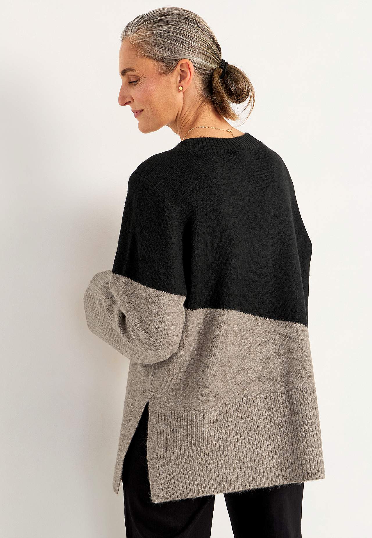 Knitted sweater with slits