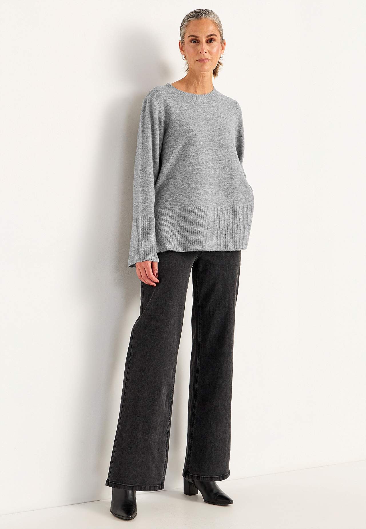 Knitted sweater with slits