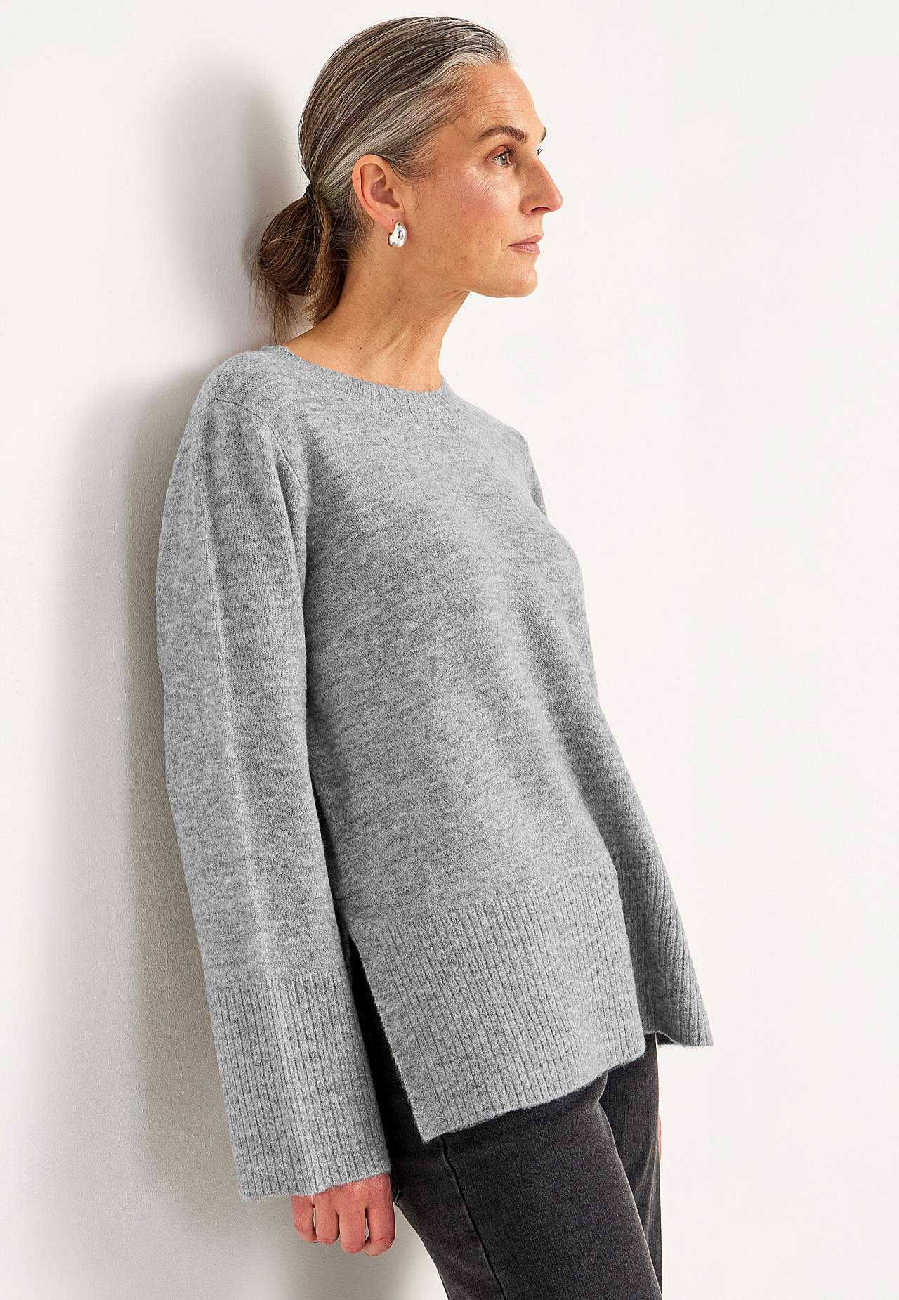 Knitted sweater with slits
