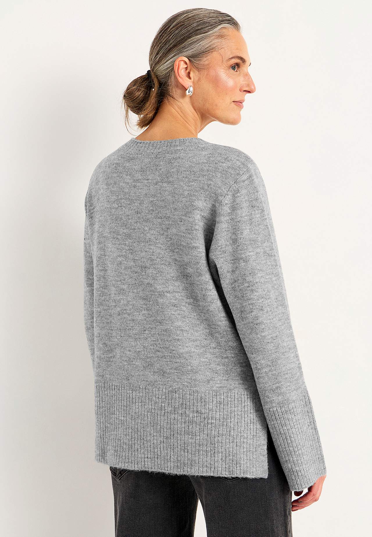Knitted sweater with slits