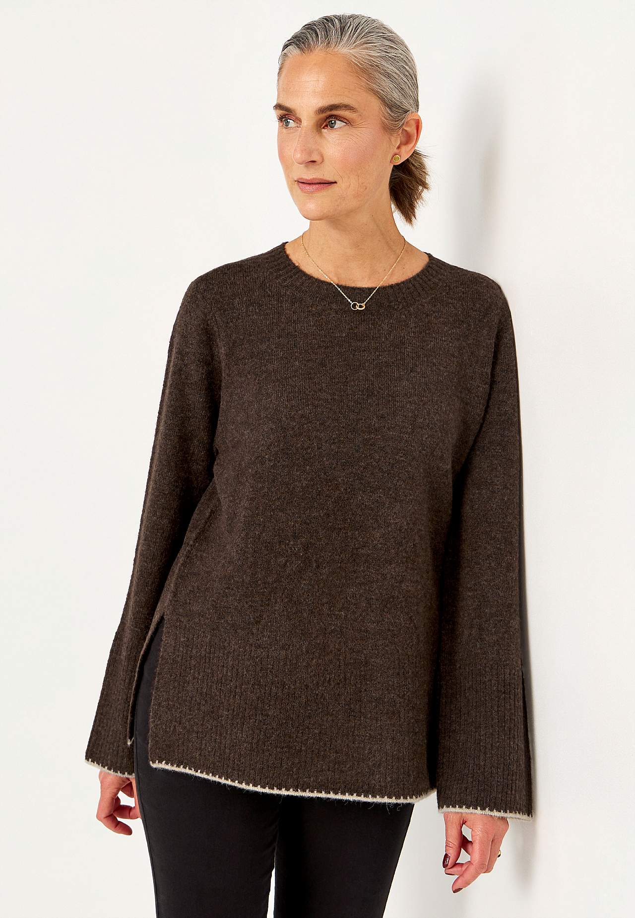 Knitted sweater with slits