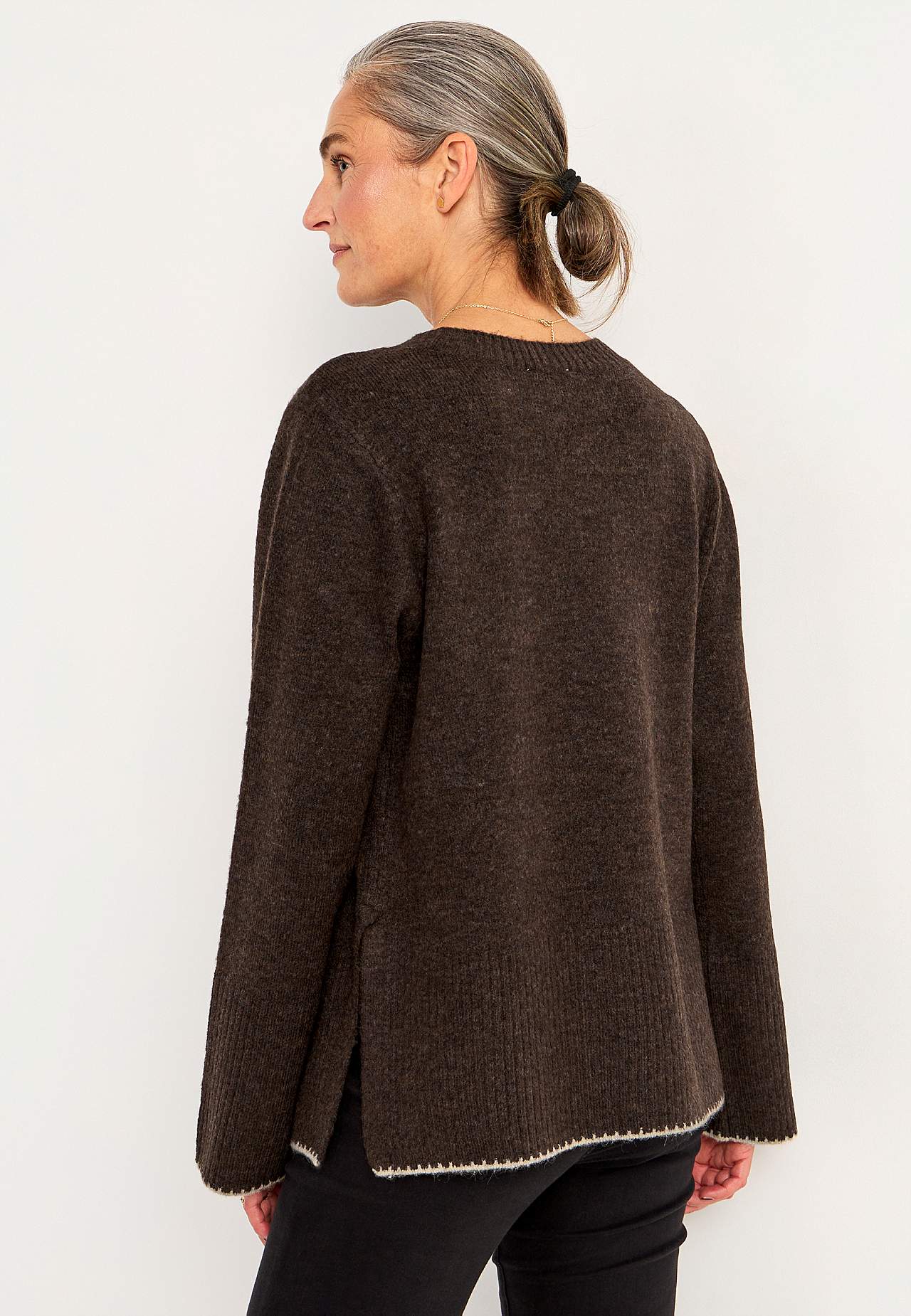 Knitted sweater with slits