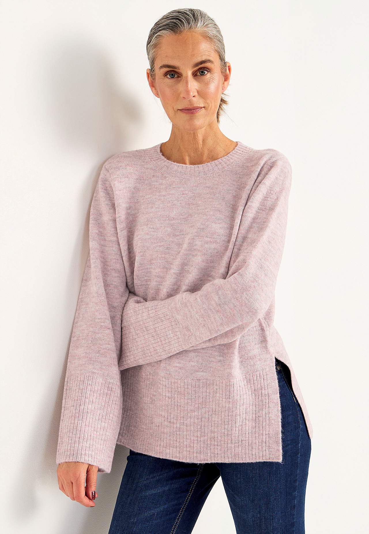 Knitted sweater with slits