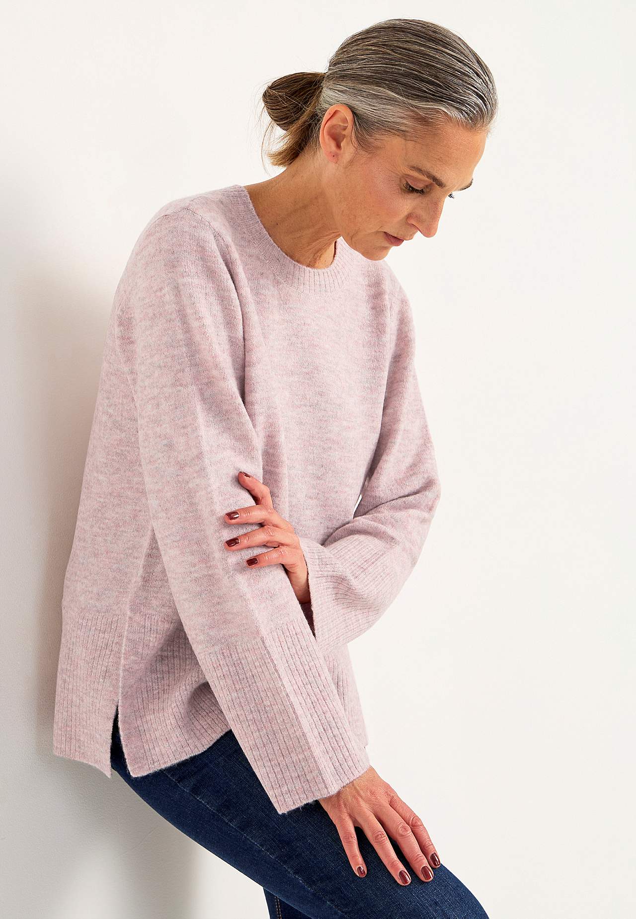 Knitted sweater with slits