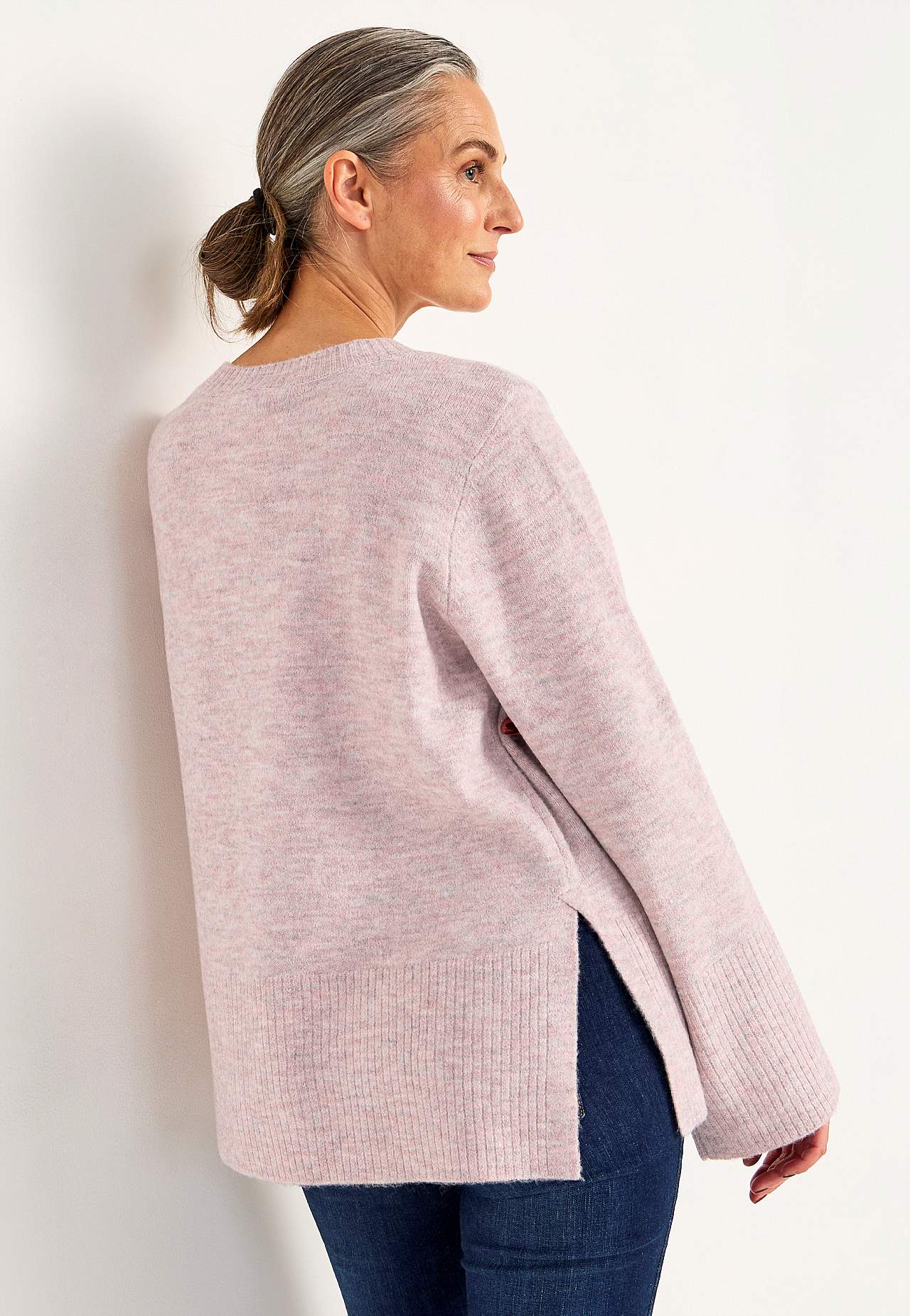 Knitted sweater with slits