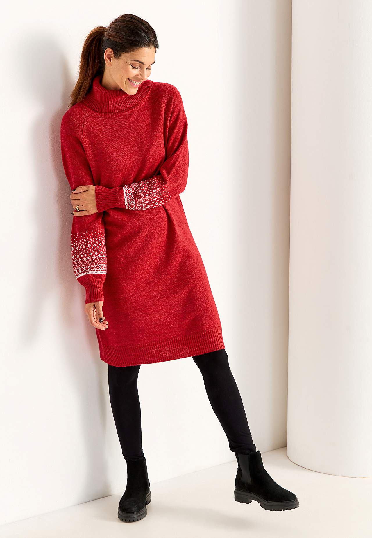 Knitted dress with jacquard patterned sleeves