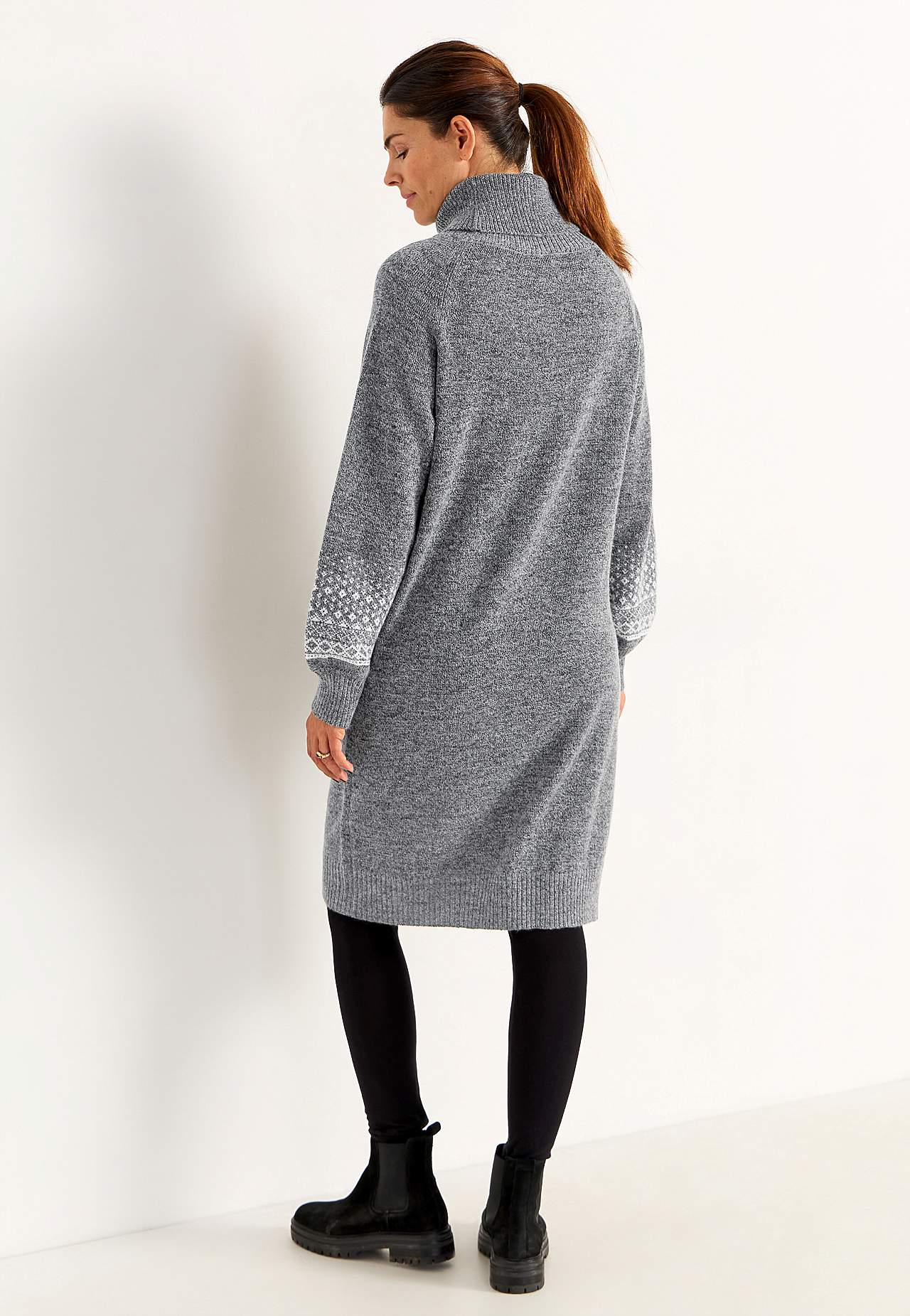 Knitted dress with jacquard patterned sleeves