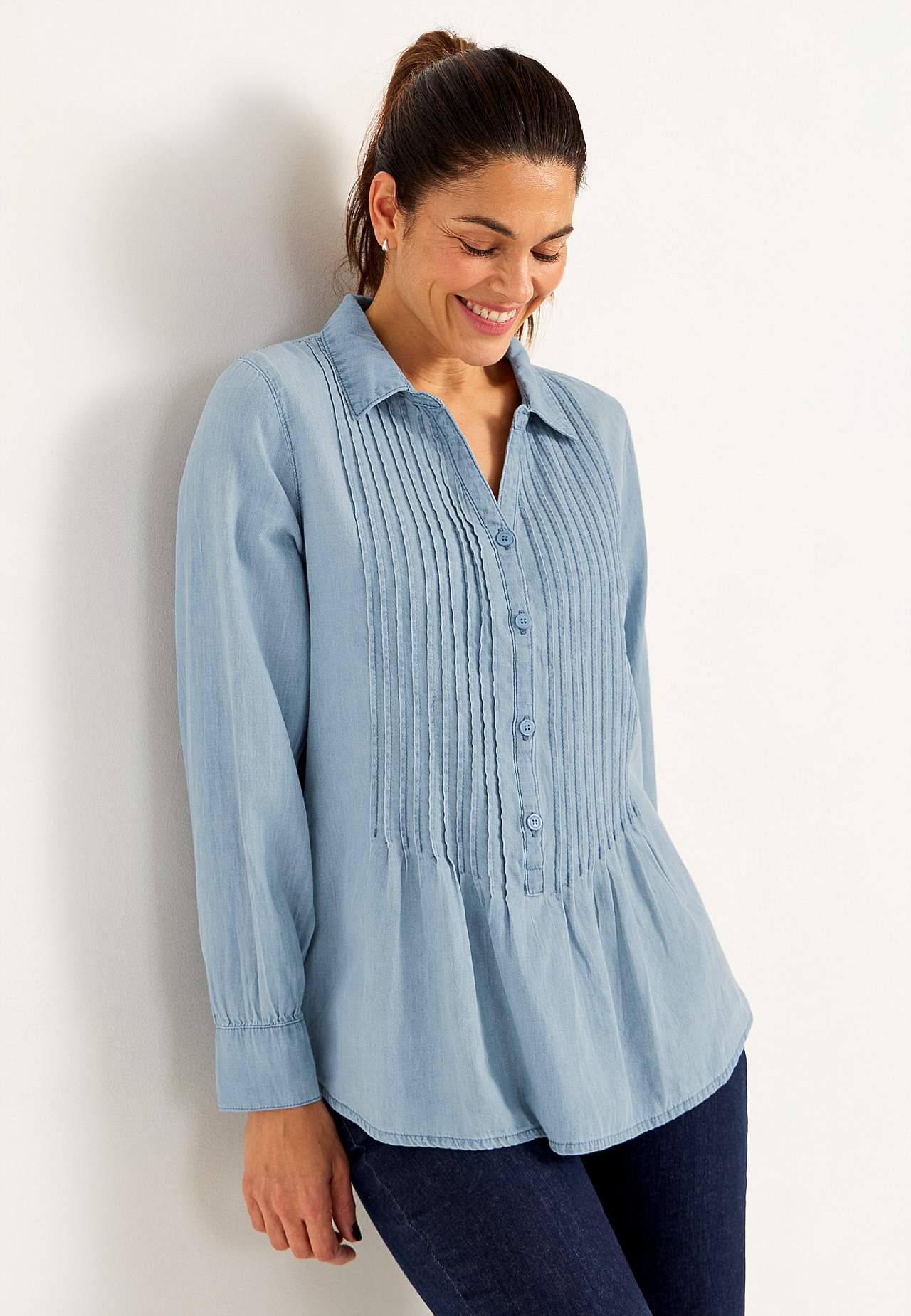 Denim blouse with sewn pleats