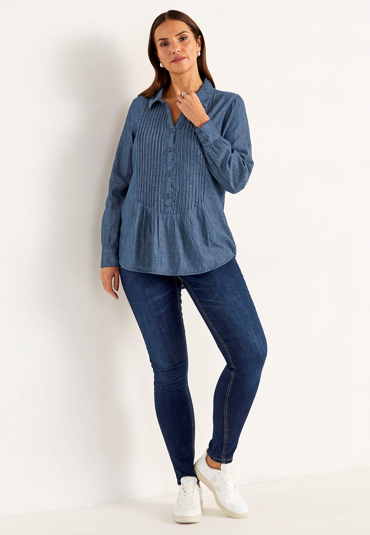 Denim blouse with sewn pleats